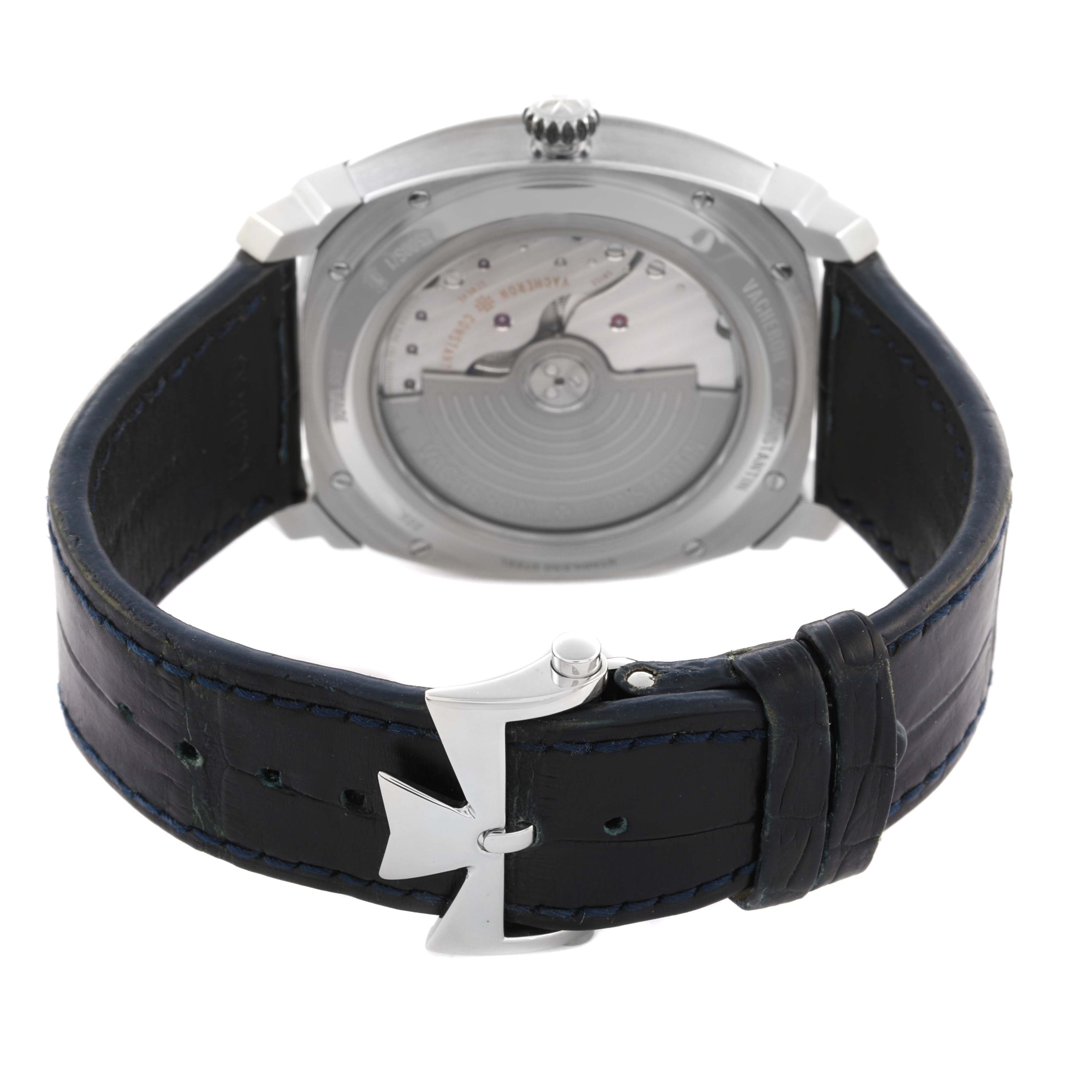 The Vacheron Constantin Quai de l'Ile watch is shown from the back, highlighting the leather strap, clasp, and case back.
