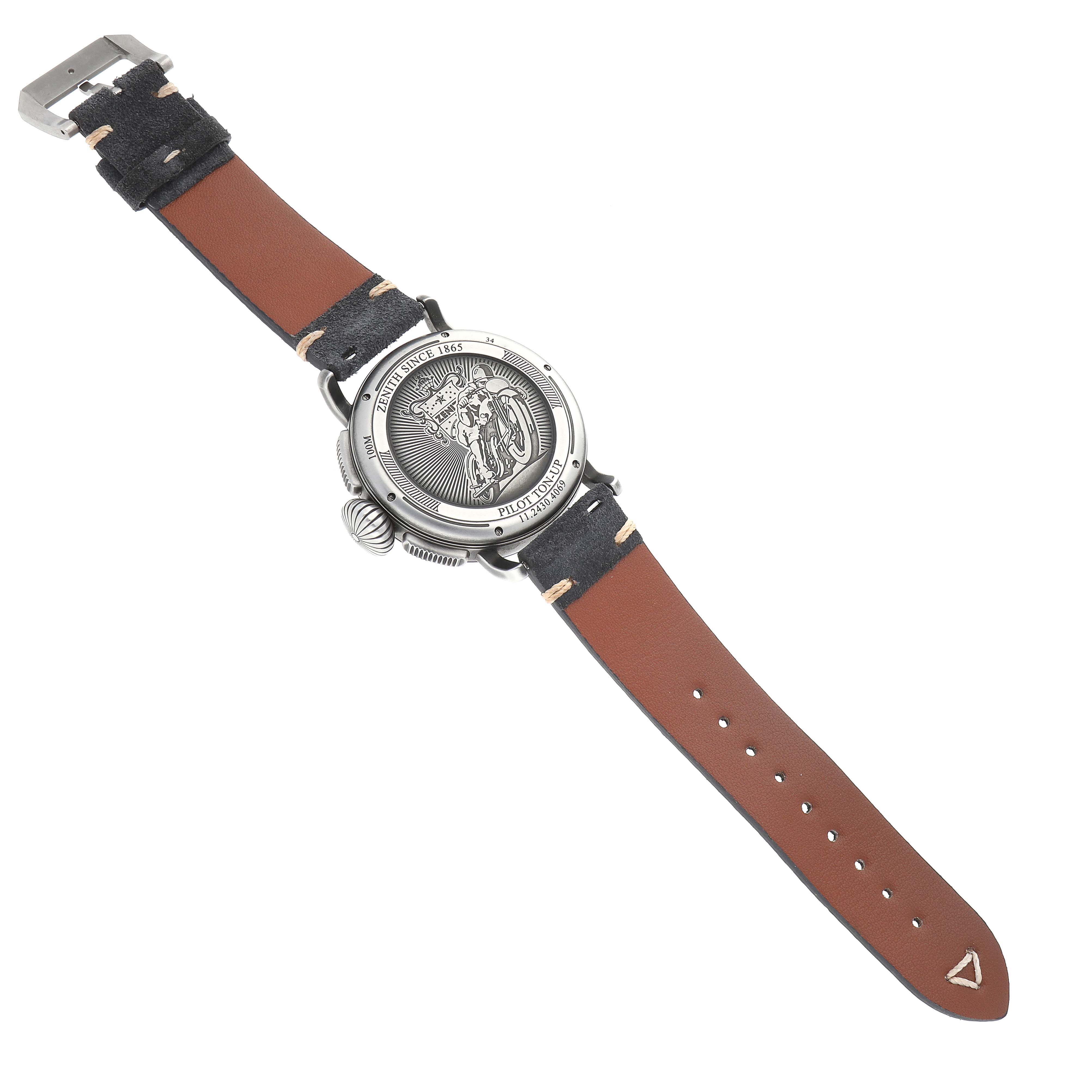 The image shows the back of the Zenith Pilot 11.2430.4069 Men's Stainless Steel Grey Dial watch, displaying its engraved case and leather strap.