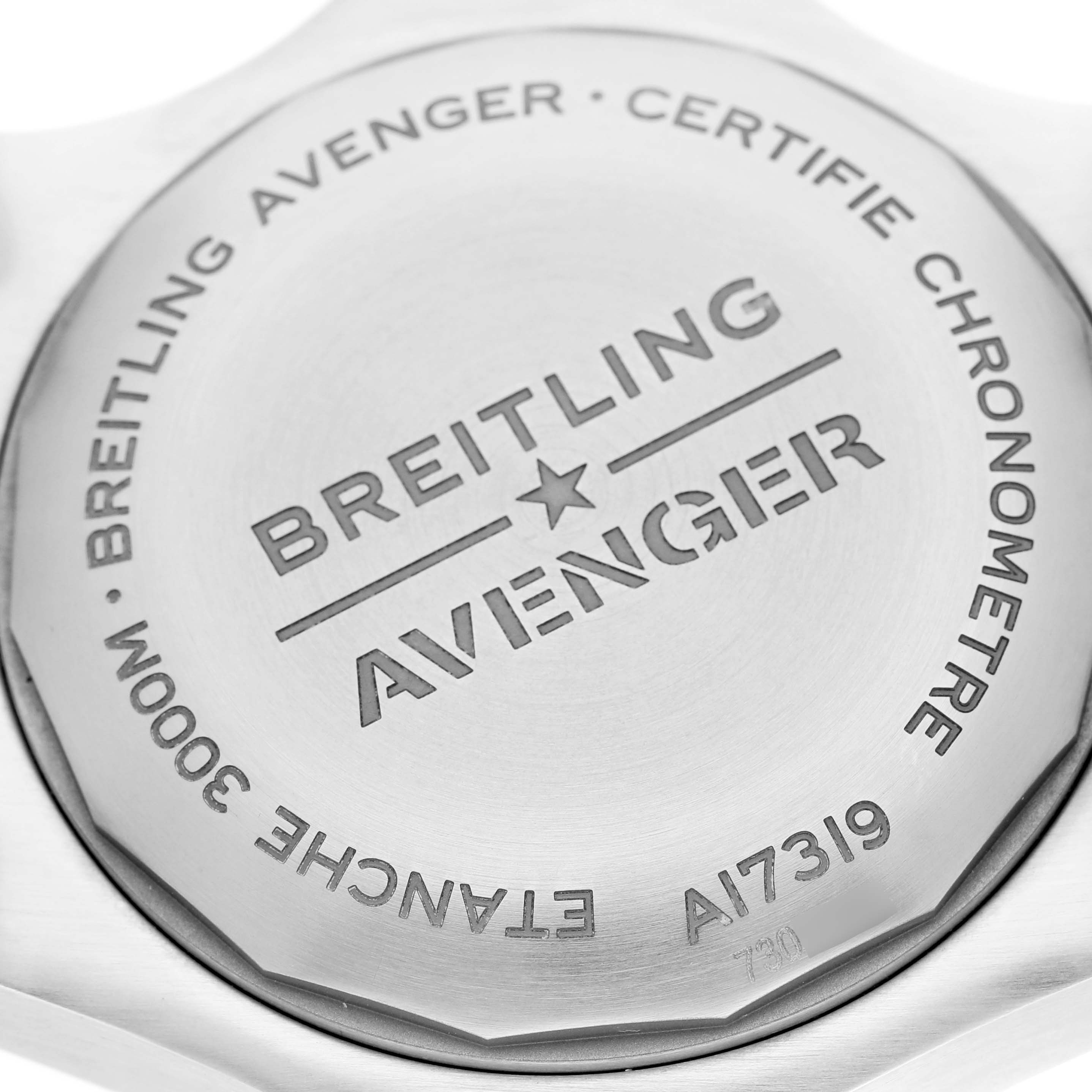 The image shows the case back of a Breitling Avenger A17319 Men's Stainless Steel Yellow Dial A17319 Men's Stainless Steel Yellow Dial watch, displaying branding and specifications.