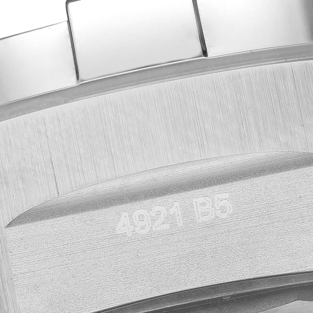 This image shows a close-up of the back case and part of the bracelet of the Breitling Avenger A17319 Men's Stainless Steel Yellow Dial A17319 Men's Stainless Steel Yellow Dial watch.