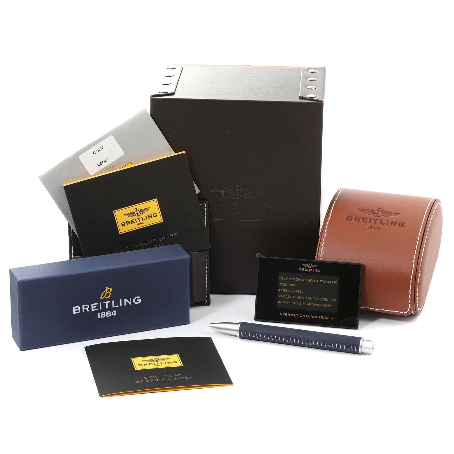 The image shows packaging and accessories for the Breitling Colt A133884Y/BE68 Men's Stainless Steel Black Dial A133884Y/BE68 Men's Stainless Steel Black Dial watch, including boxes, manuals, a pen, and warranty cards.