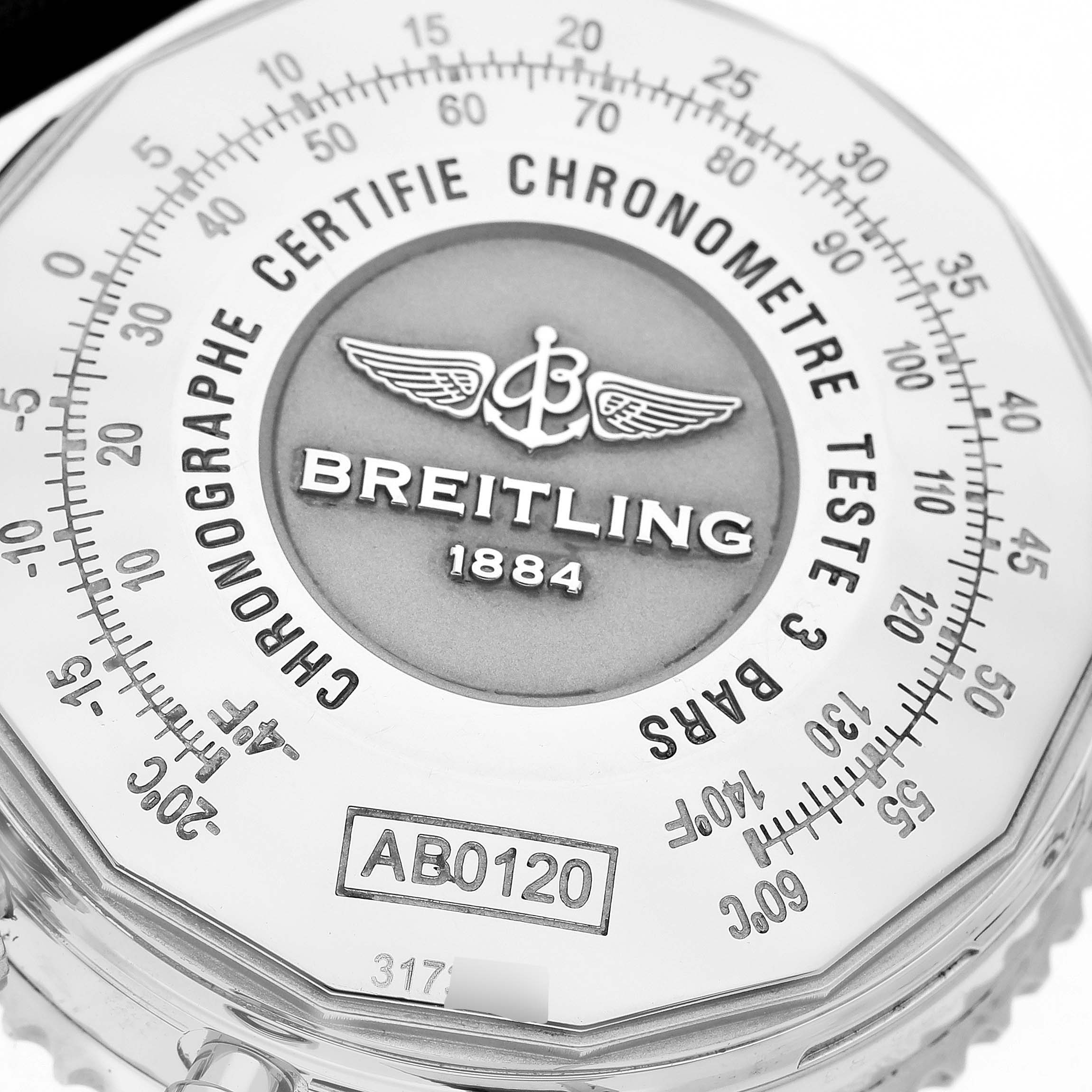 This image shows a close-up of the Navitimer watch face by Breitling, highlighting the logo, model number, and chronograph markings.