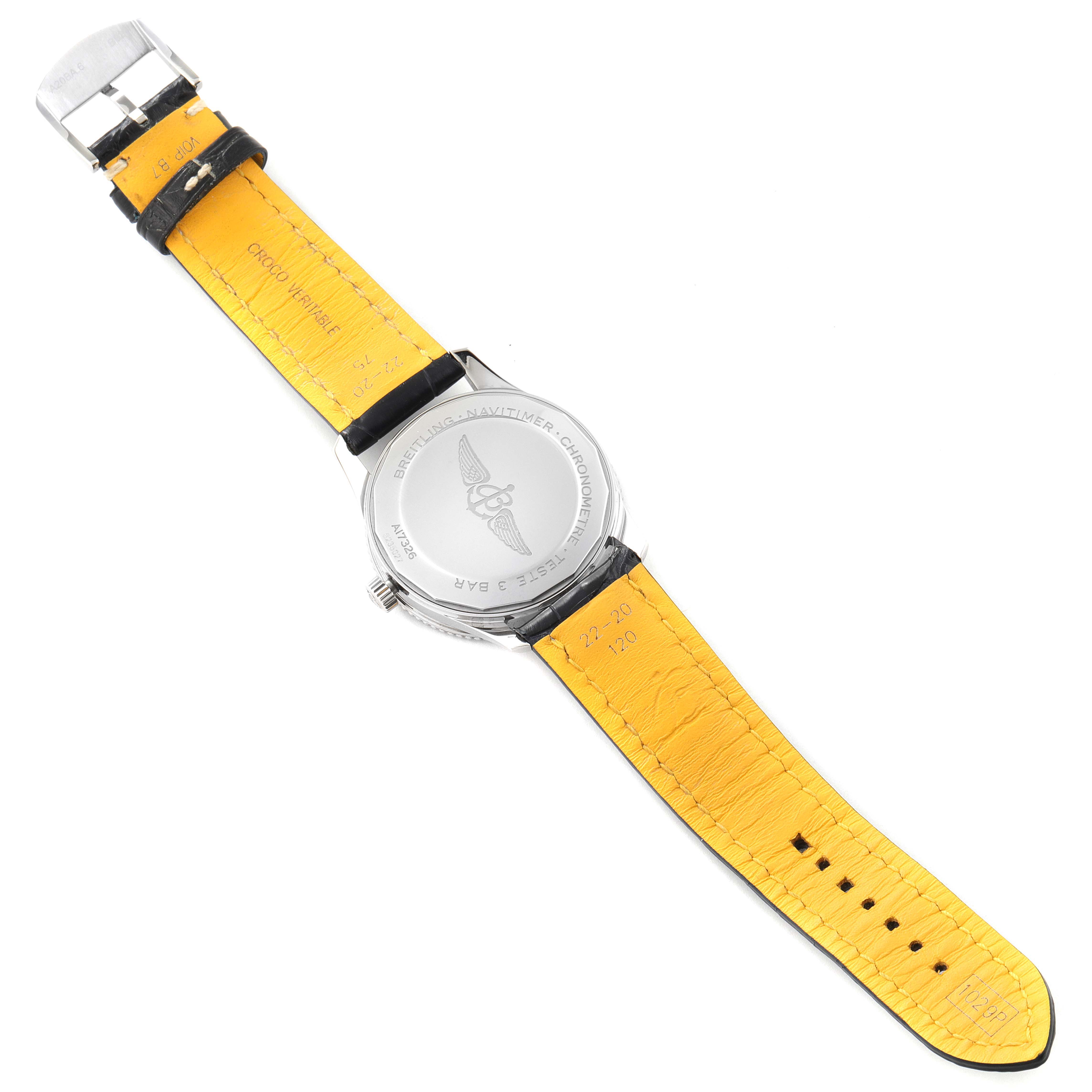 The image shows the back view of a Breitling Navitimer A17326 Men
s Stainless Steel Blue Dial A17326 Men
s Stainless Steel Blue Dial watch, highlighting its case back and yellow strap.