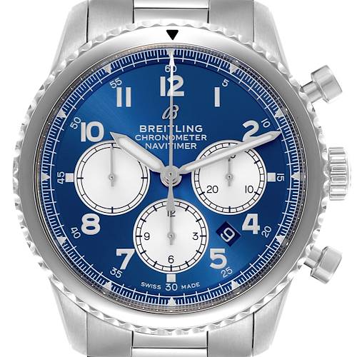 The Breitling Navitimer watch is shown from a front angle highlighting the dial, chronograph subdials, and silver case.