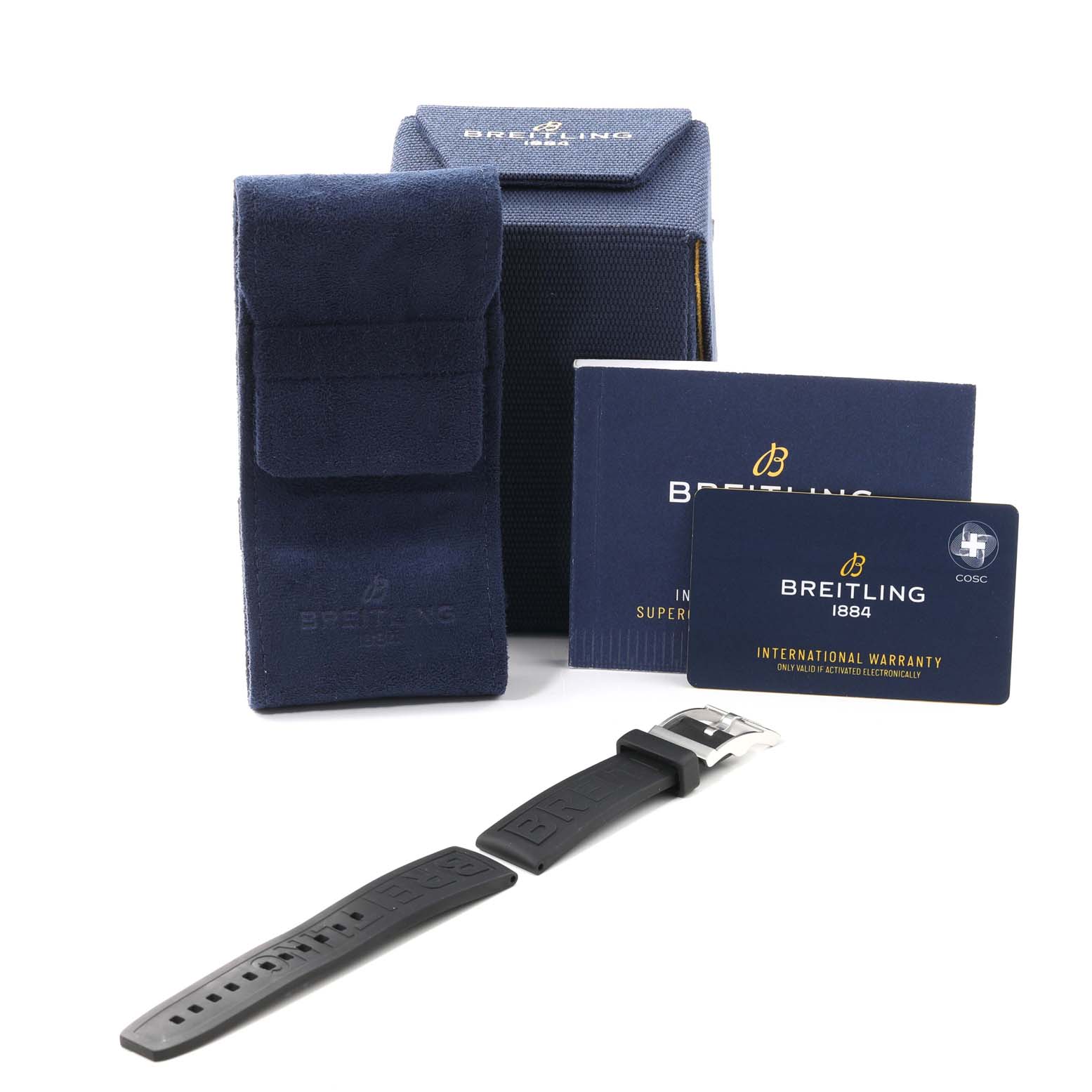 This image shows the packaging, warranty card, manual, and a rubber strap for the Breitling Superocean A17365 Men's Stainless Steel Blue Dial A17365 Men's Stainless Steel Blue Dial watch.