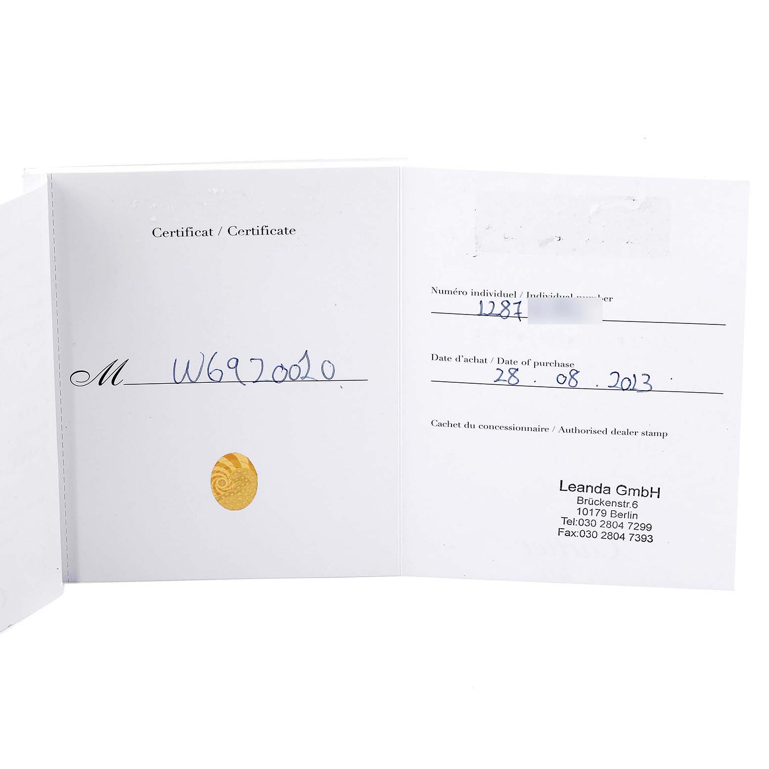 This image shows the certificate of the Ballon Bleu model by Cartier, displaying individual number, purchase date, and other details.