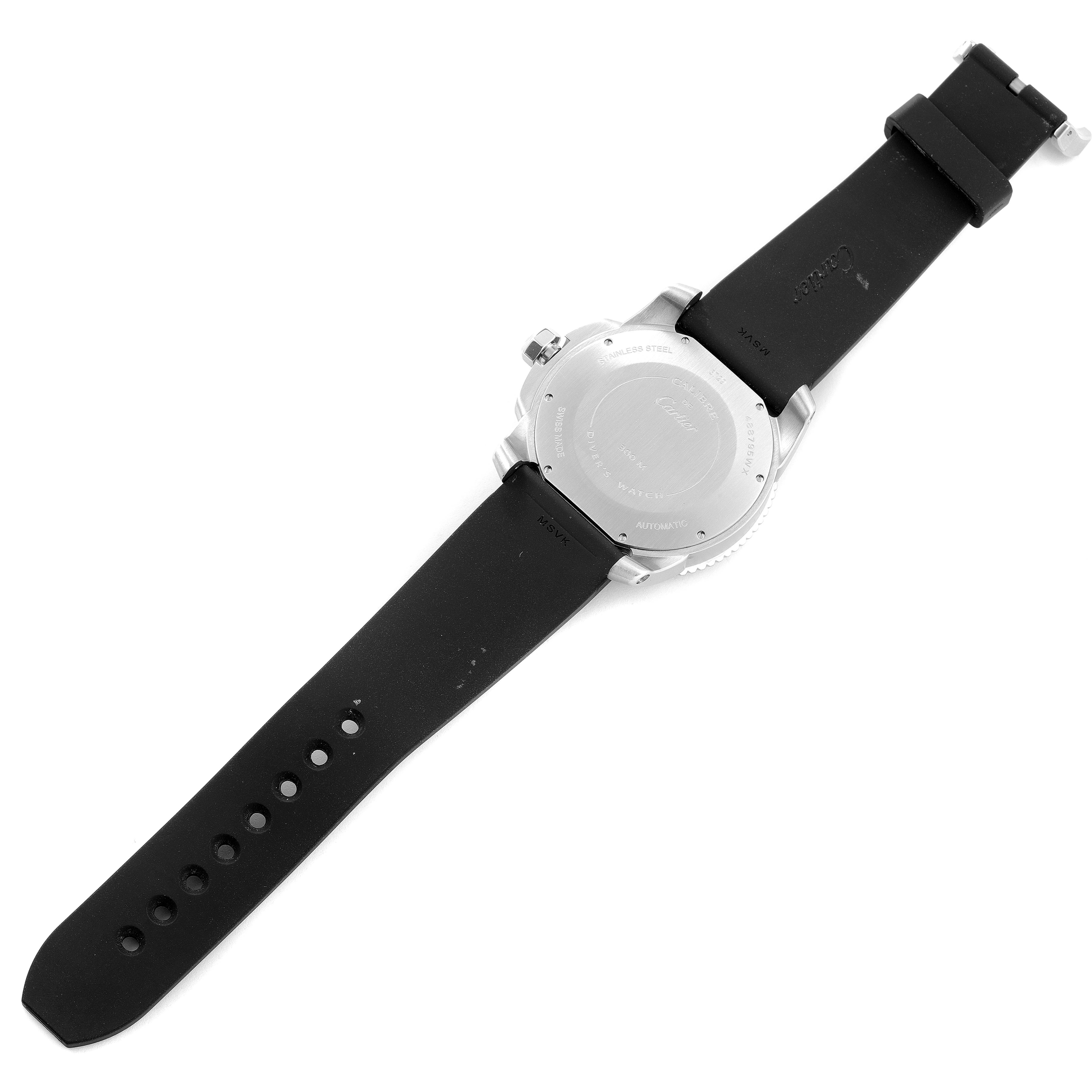 The image shows the back view of a Calibre de Cartier watch by Cartier, including its case back and black strap.