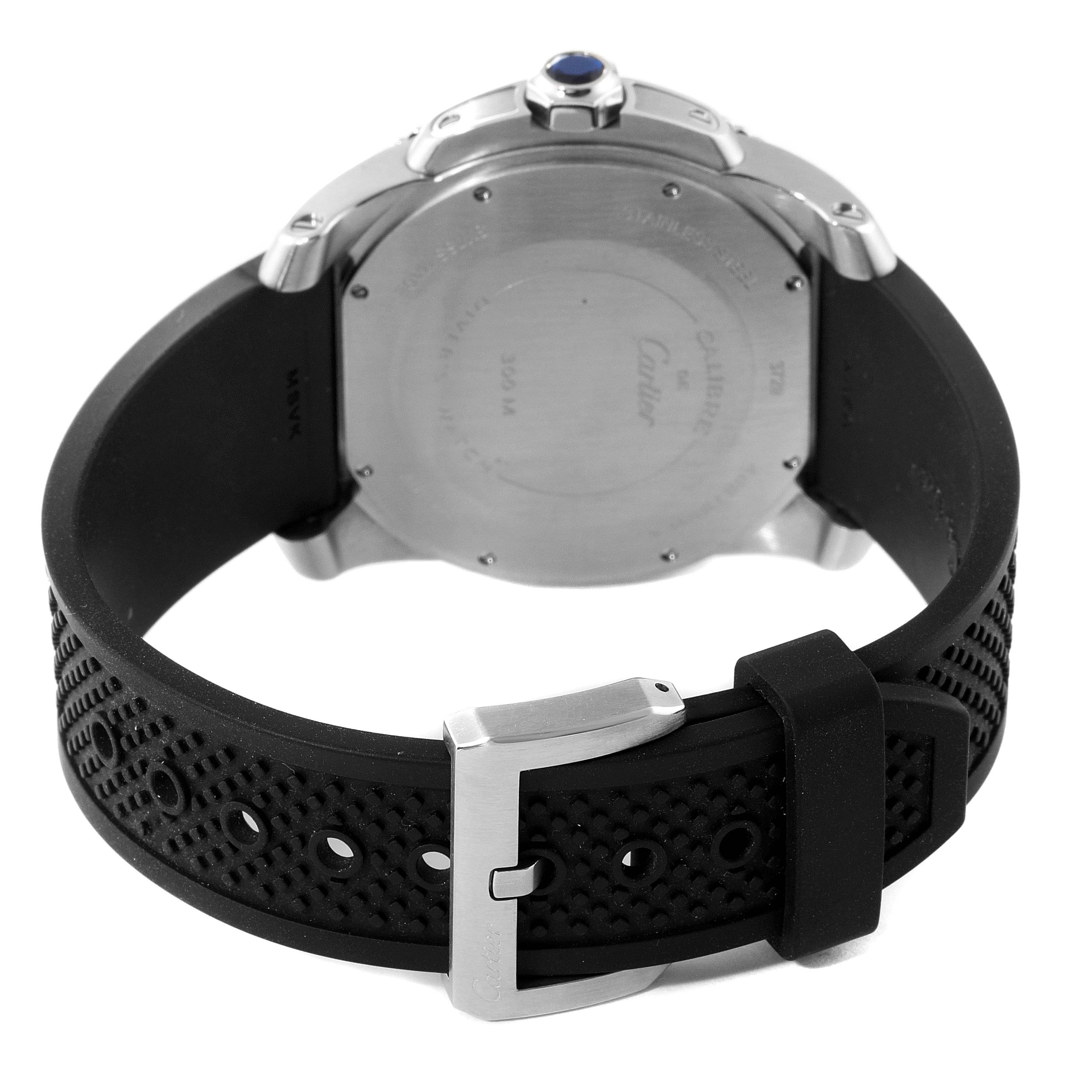 This is the back view of a Calibre de Cartier watch by Cartier, showing the case back, crown, and rubber strap with a buckle.