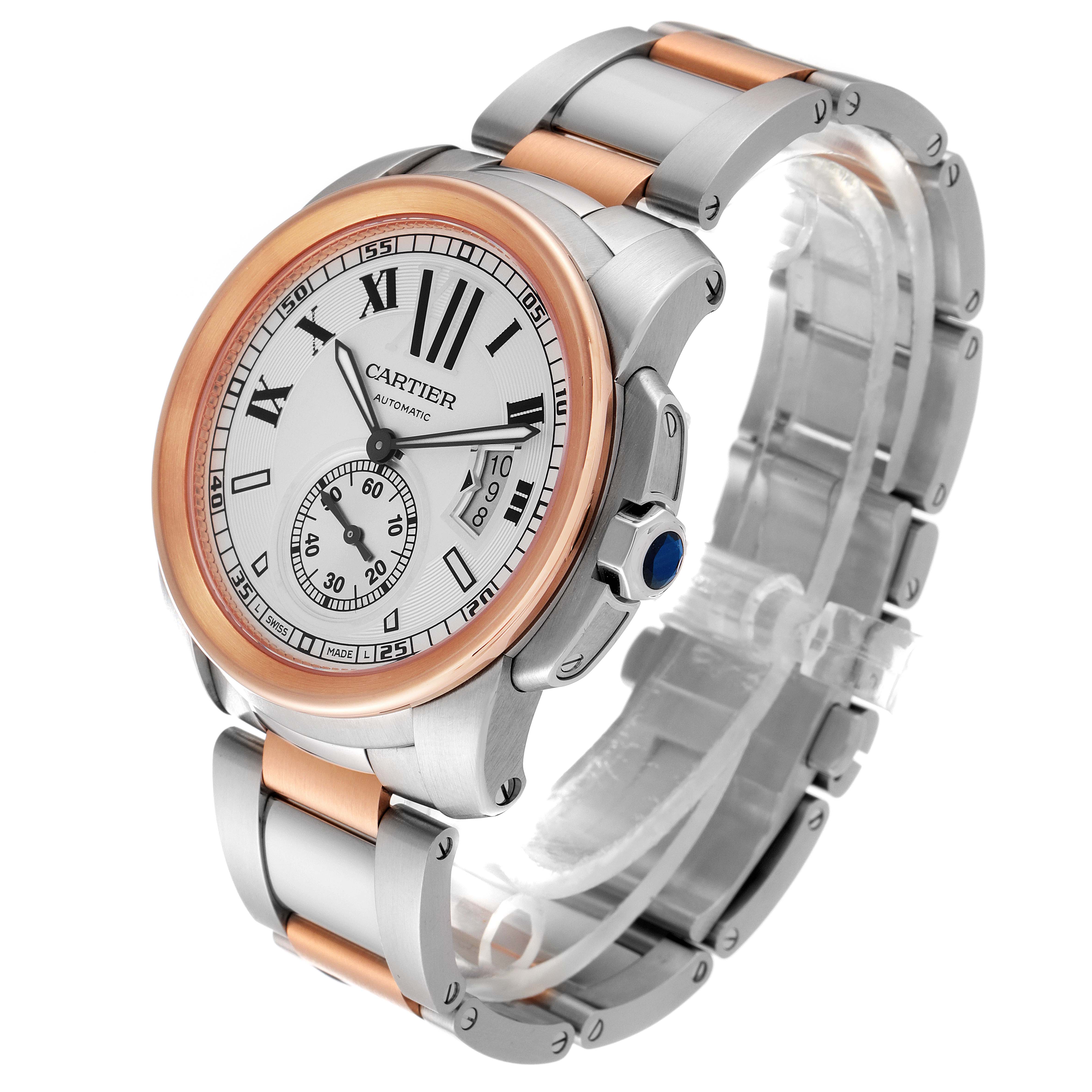 The image shows a Calibre de Cartier watch by Cartier at a three-quarter front angle, highlighting its face, bezel, and bracelet.