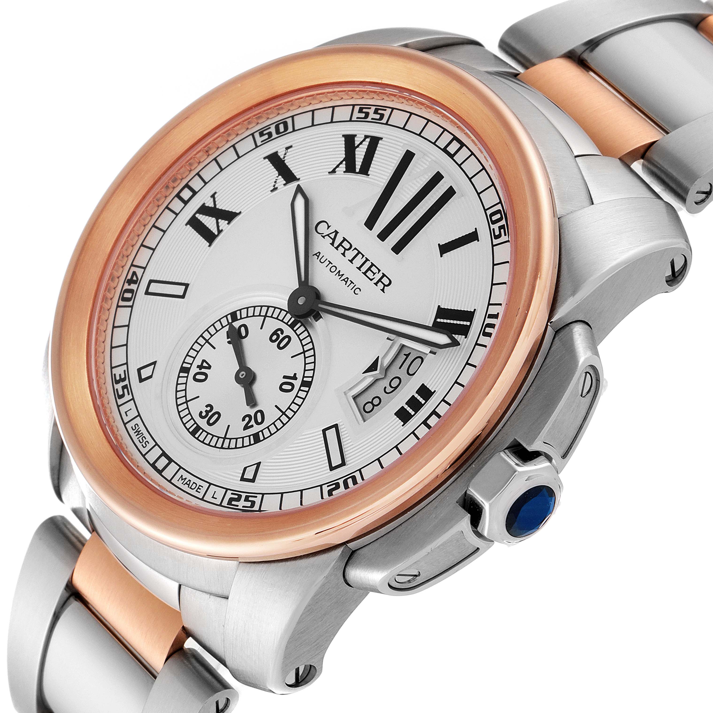 The image shows a close-up, angled view of a Cartier Calibre de Cartier W7100036 Men's Steel and Gold (two tone) Silver Dial W7100036 Men's Steel and Gold (two tone) Silver Dial watch, highlighting its face, bezel, and part of the band.