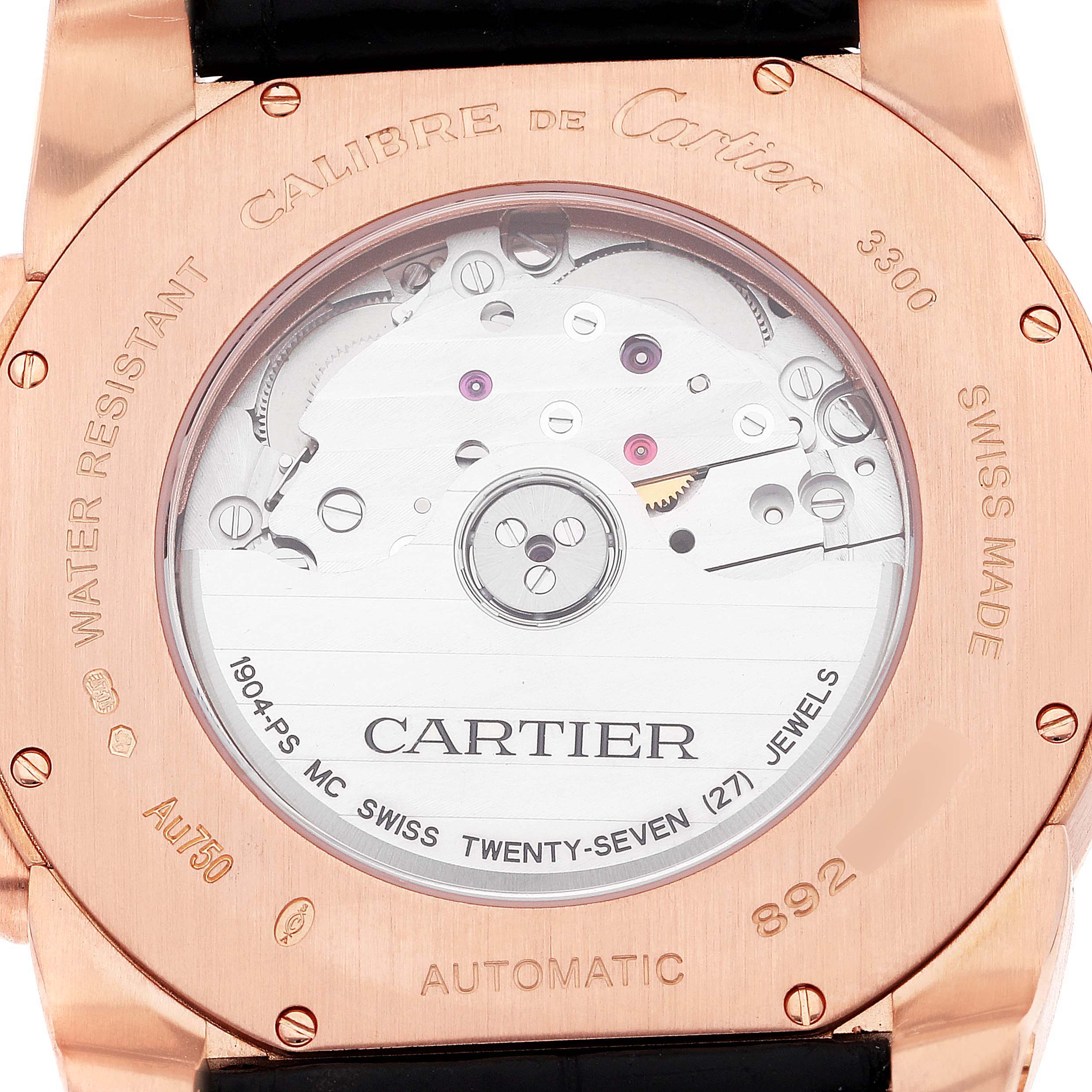 This image shows the case back of the Calibre de Cartier model by Cartier, displaying the movement and inscriptions.
