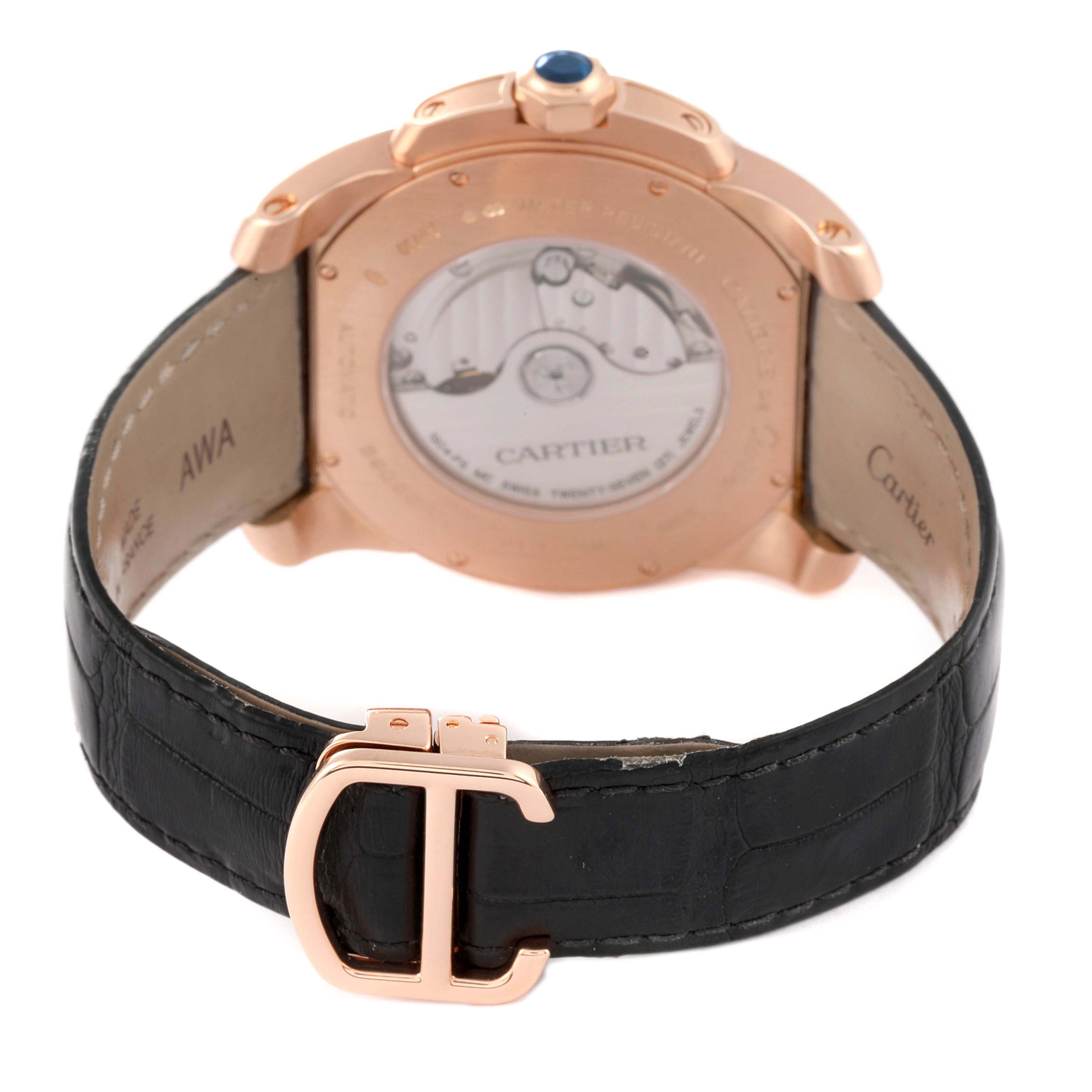 The image shows the back of a Calibre de Cartier watch by Cartier, highlighting its buckle and movement through a clear case back.