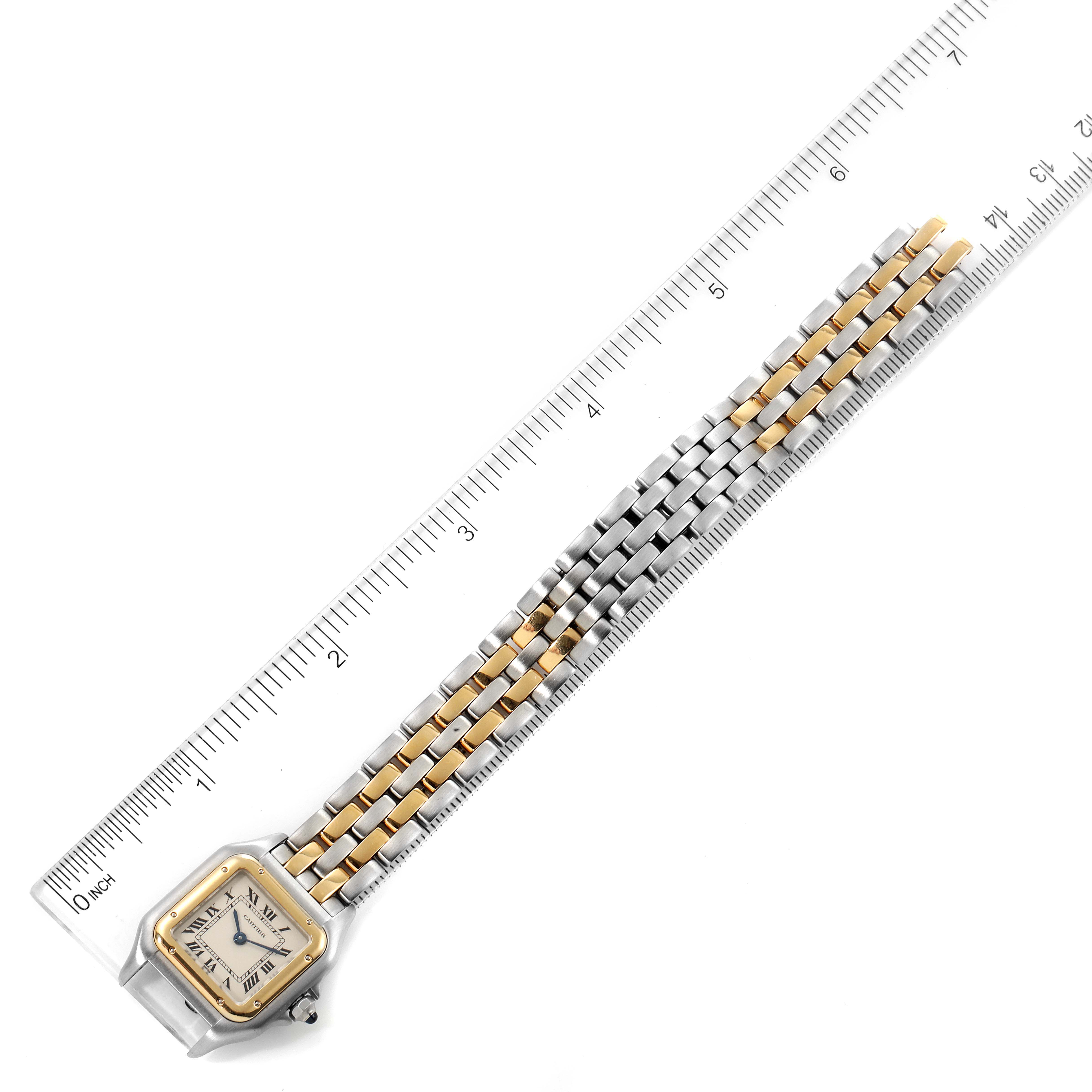 The Cartier Panthere W25029B6 Women's Steel and Gold (two tone) Silver Dial W25029B6 Women's Steel and Gold (two tone) Silver Dial watch is shown from an overhead angle, highlighting its face and full two-tone bracelet beside a ruler.
