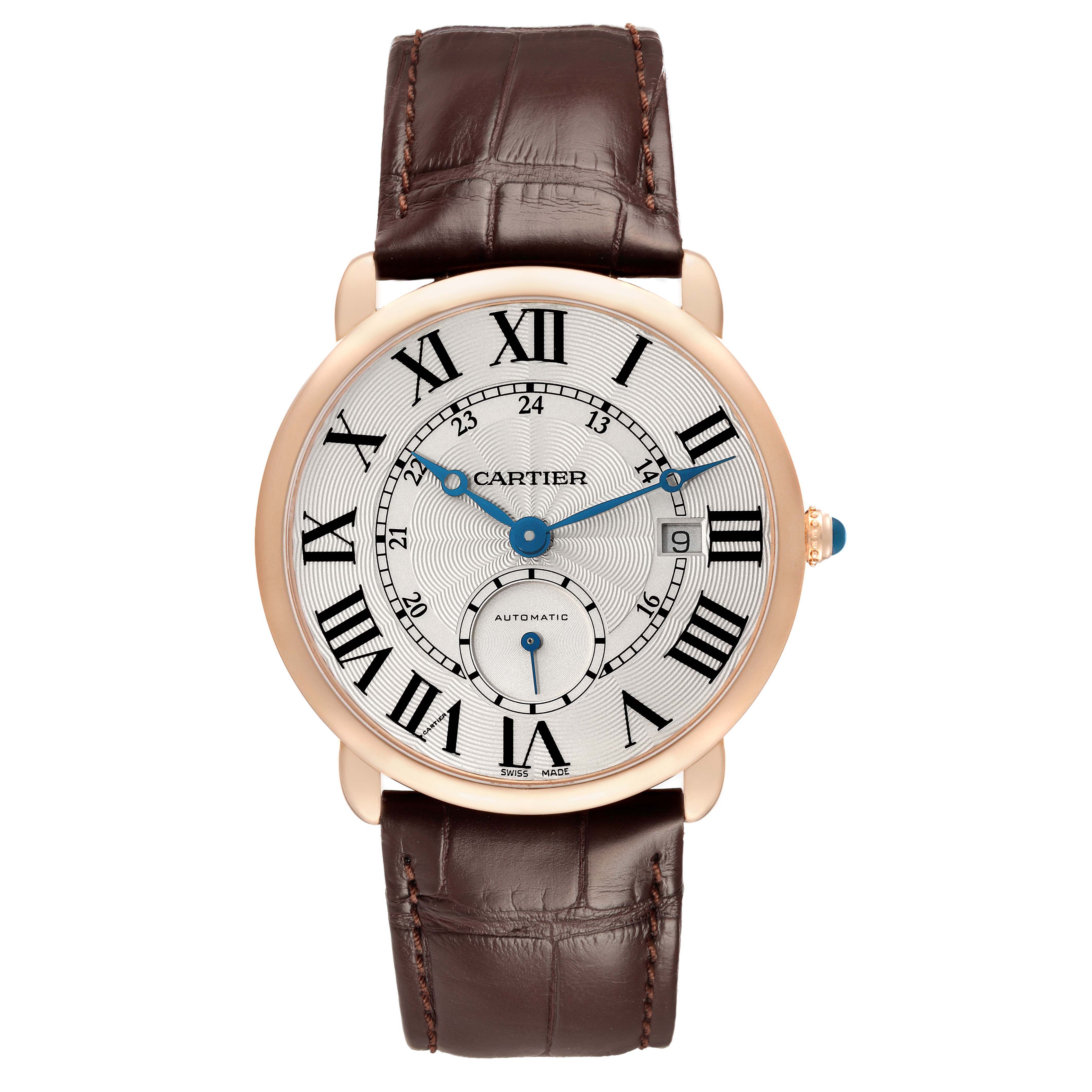 The Cartier Ronde W6801005 Men's Rose Gold Silver Dial watch is shown from the front, displaying its dial, case, Roman numerals, blue hands, crown, and brown leather strap.
