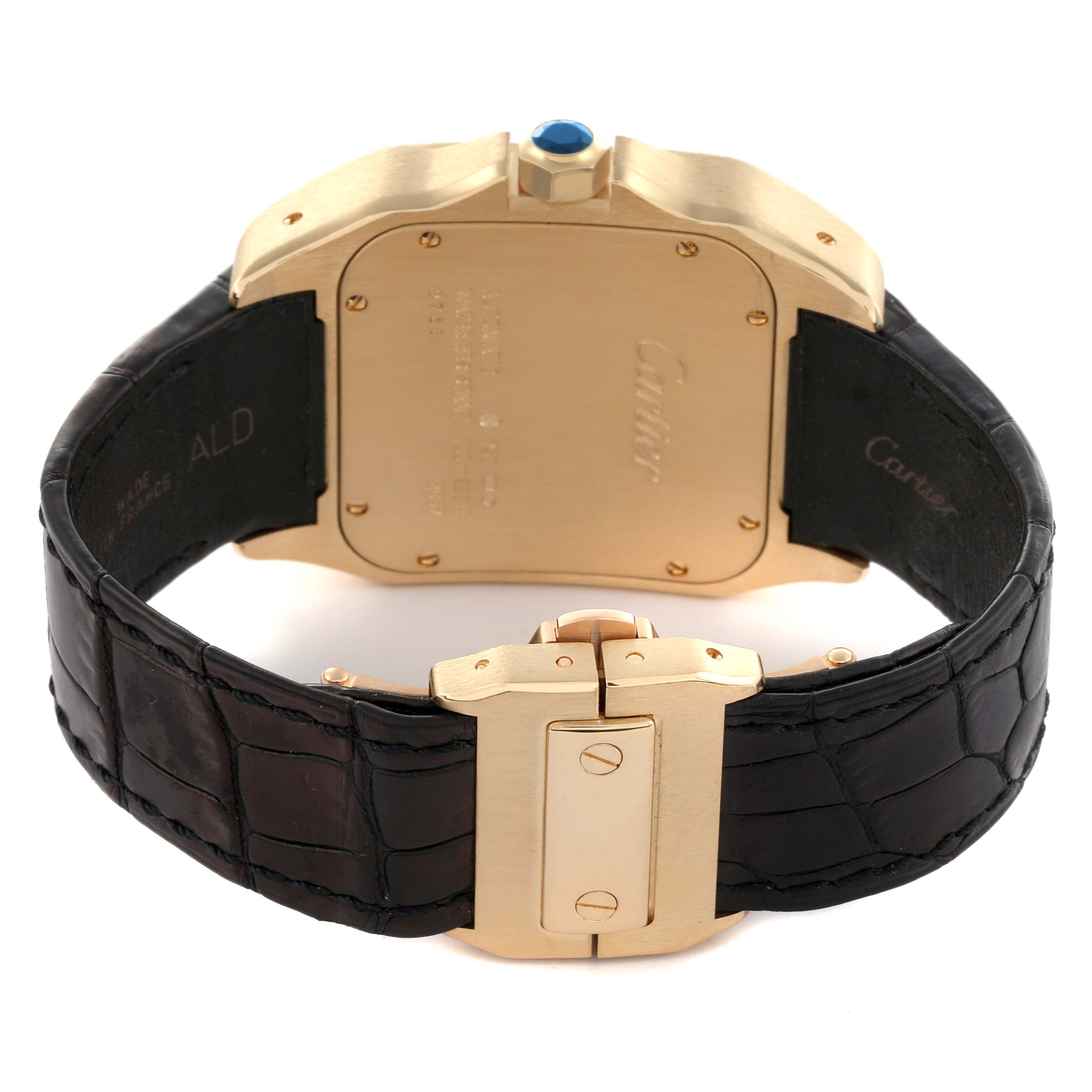 The image shows the back and clasp of the Cartier Santos W20071Y1 Men's Yellow Gold Silver Dial W20071Y1 Men's Yellow Gold Silver Dial watch, highlighting the case, strap, and crown from a rear angle.