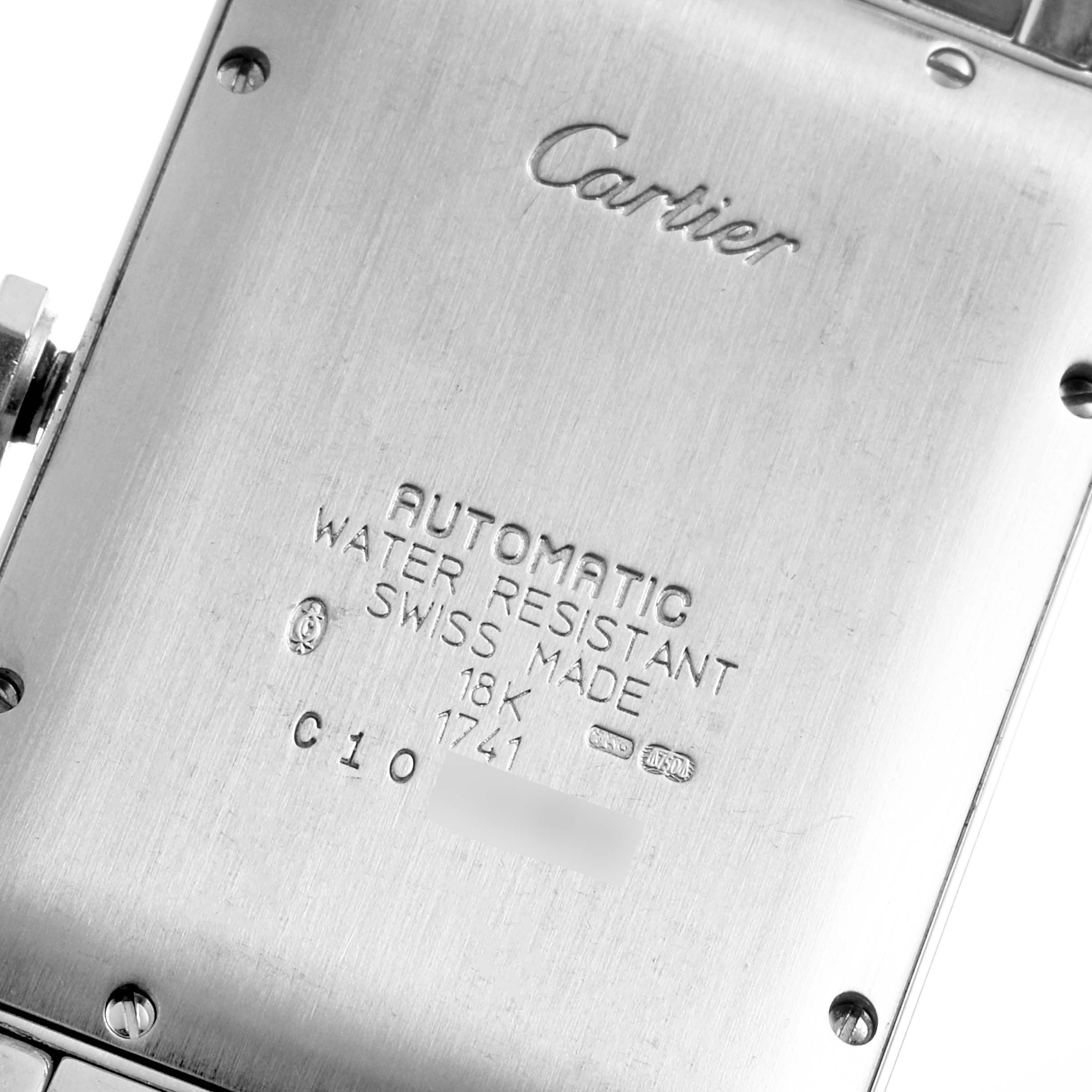 The image shows the back case of a Cartier Tank Américaine watch, displaying brand, model, and specifications.