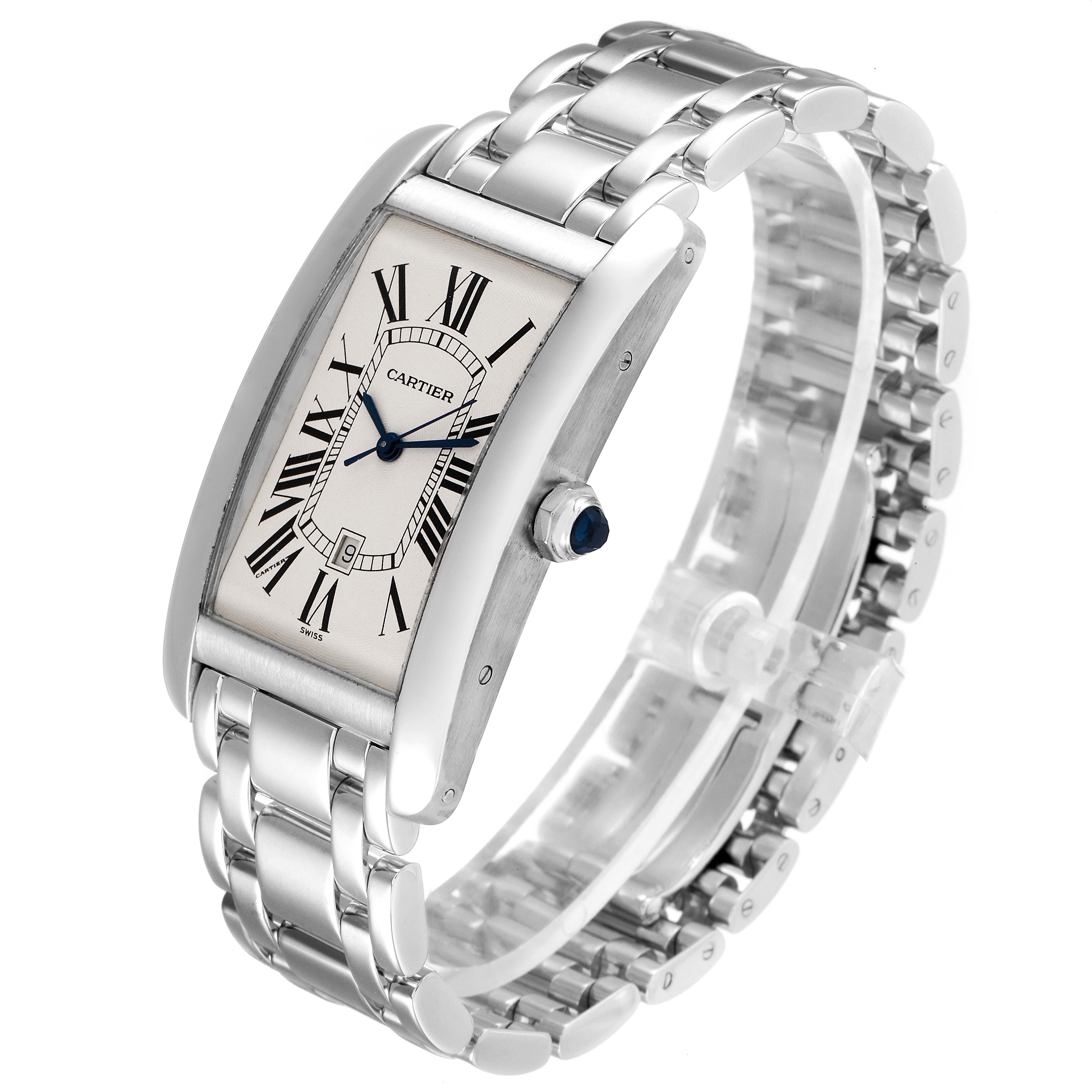 The image shows a Cartier Tank Americaine W26032L1 Men's White Gold Silver Dial W26032L1 Men's White Gold Silver Dial watch angled slightly to the right, displaying the face, bracelet, and crown.