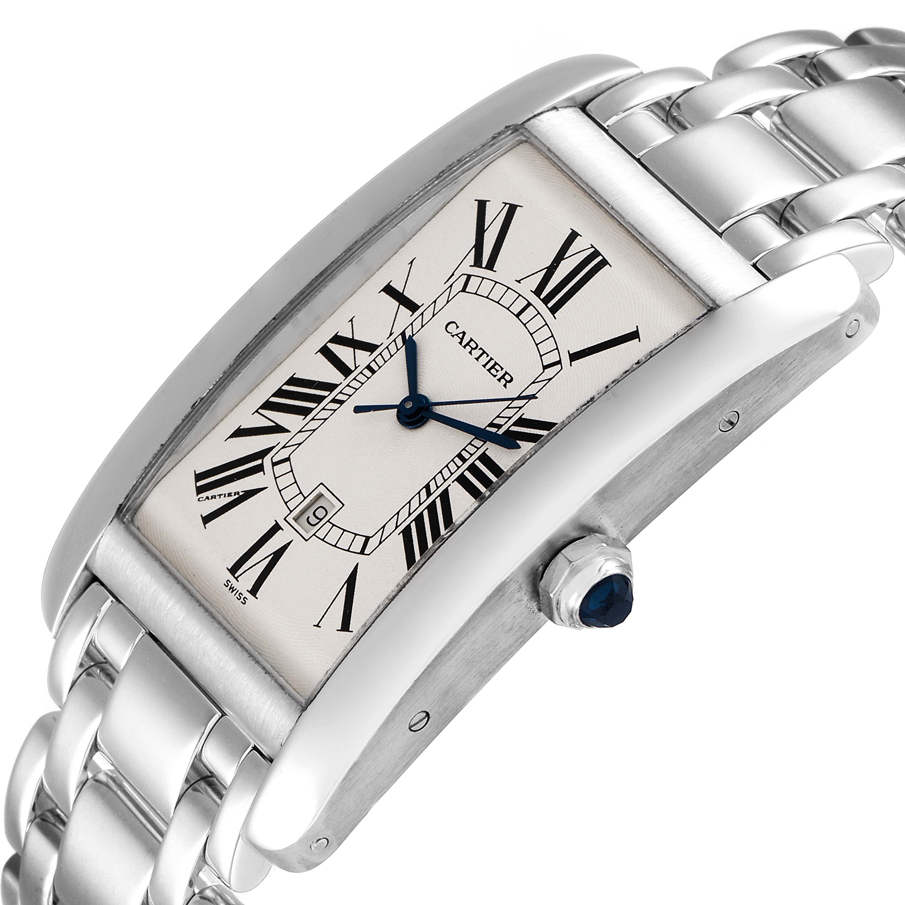 The image shows a Cartier Tank Americaine W26032L1 Men's White Gold Silver Dial W26032L1 Men's White Gold Silver Dial watch from an angled side view, highlighting the dial, crown, and part of the metal bracelet.