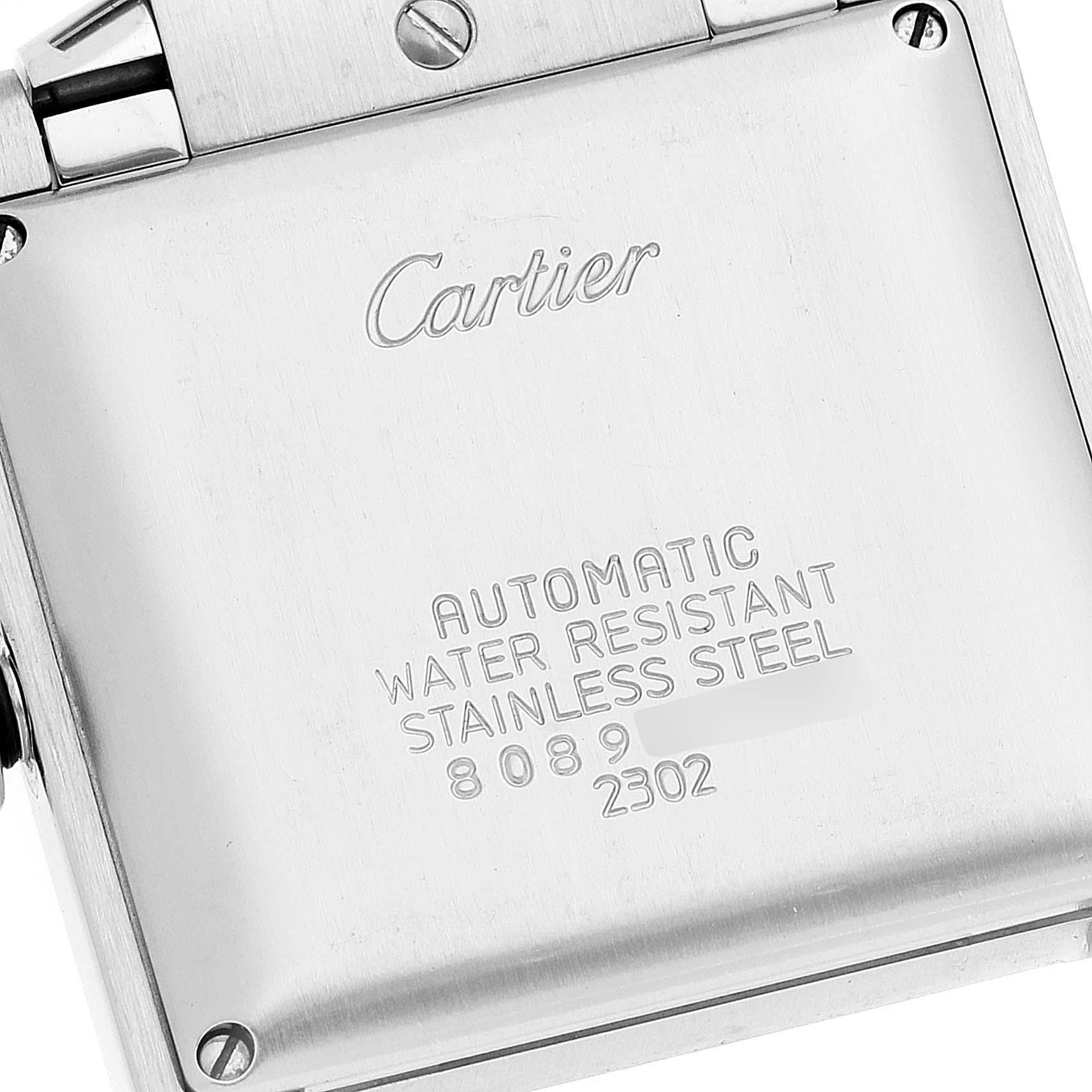 The image shows the back casing of a Cartier Tank Française watch, featuring the brand name and specifications.