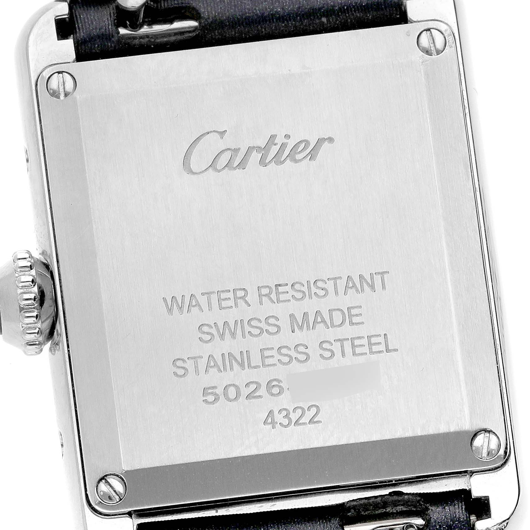 The image shows the back case of a Tank Must model by Cartier, highlighting details like water resistance and Swiss made markings.