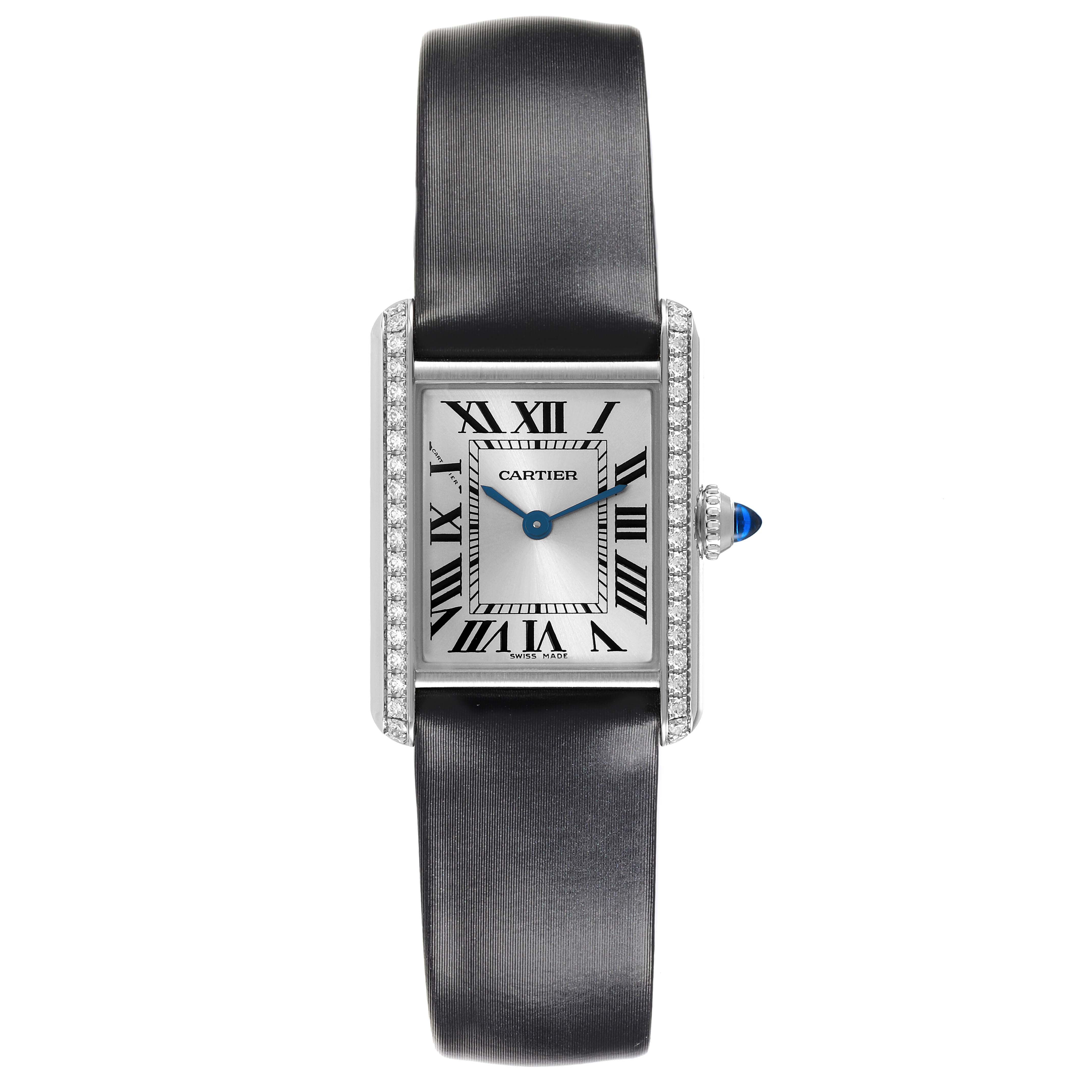 The Cartier Tank Must W4TA0016 Women's Stainless Steel Silver Dial W4TA0016 Women's Stainless Steel Silver Dial watch is shown from a front angle, displaying its face, strap, and crown with a blue cabochon.