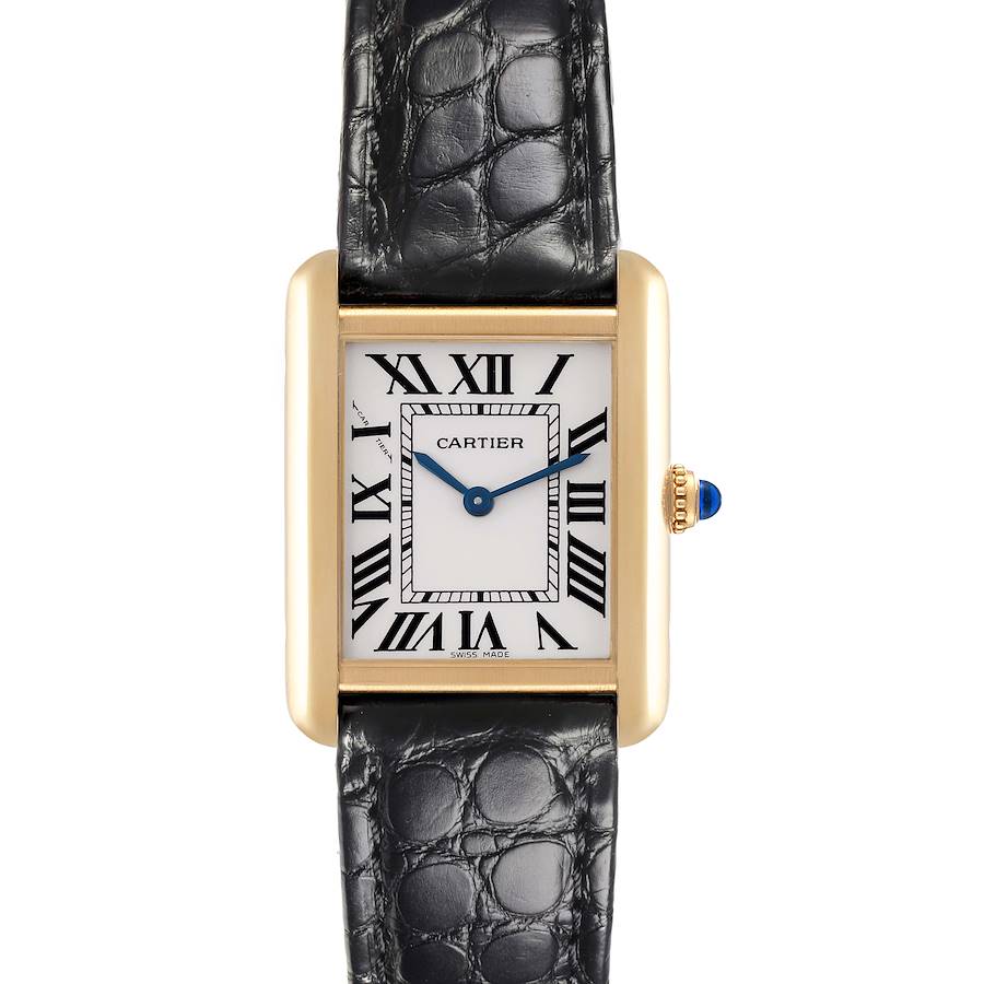 The Cartier Tank Solo watch is shown from the front, highlighting its face, gold-tone case, black leather strap, and blue gemstone crown.