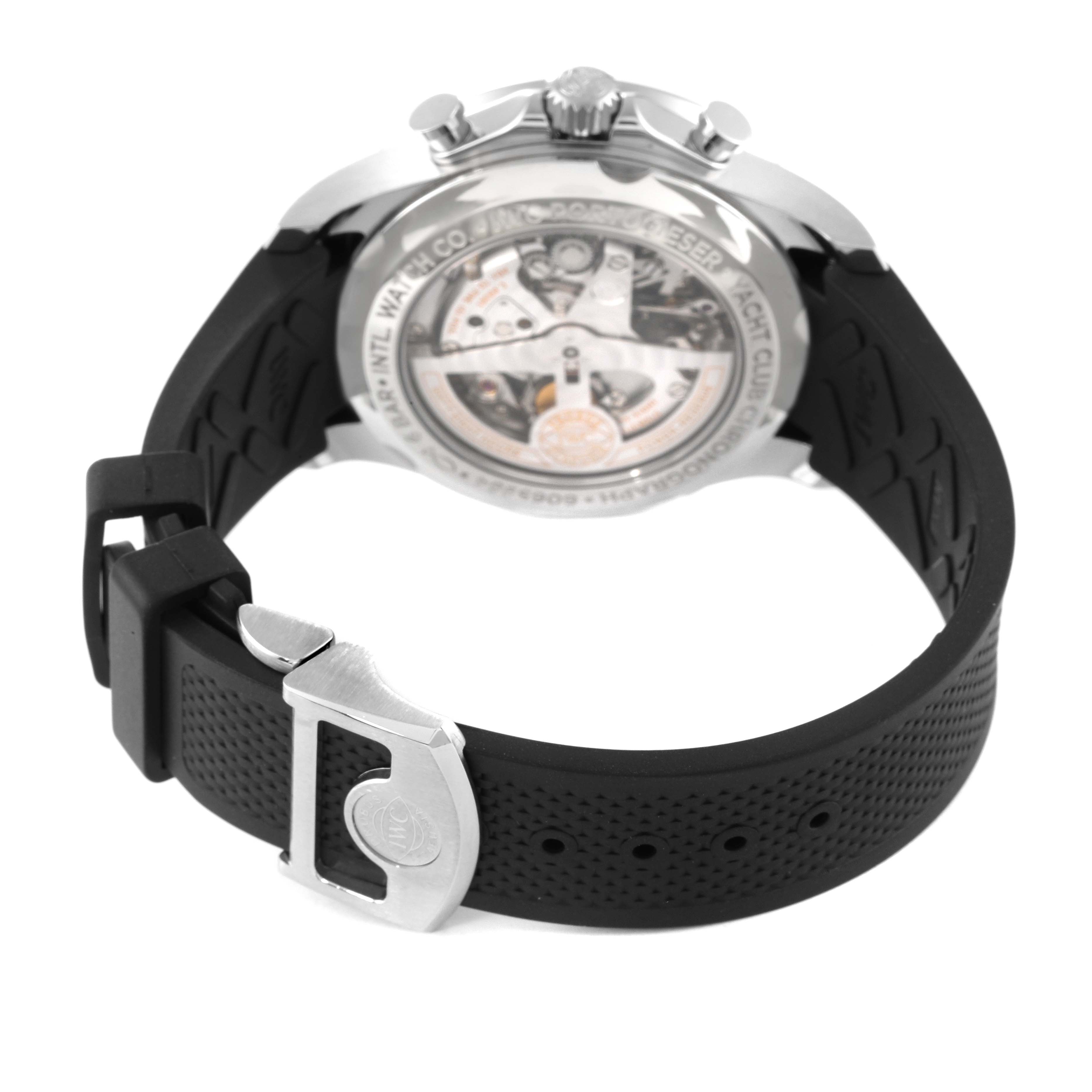 This image shows the back view of an IWC Portuguese IW390502 Men's Stainless Steel Silver Dial IW390502 Men's Stainless Steel Silver Dial model watch, highlighting the transparent case back and a portion of the rubber strap and clasp.