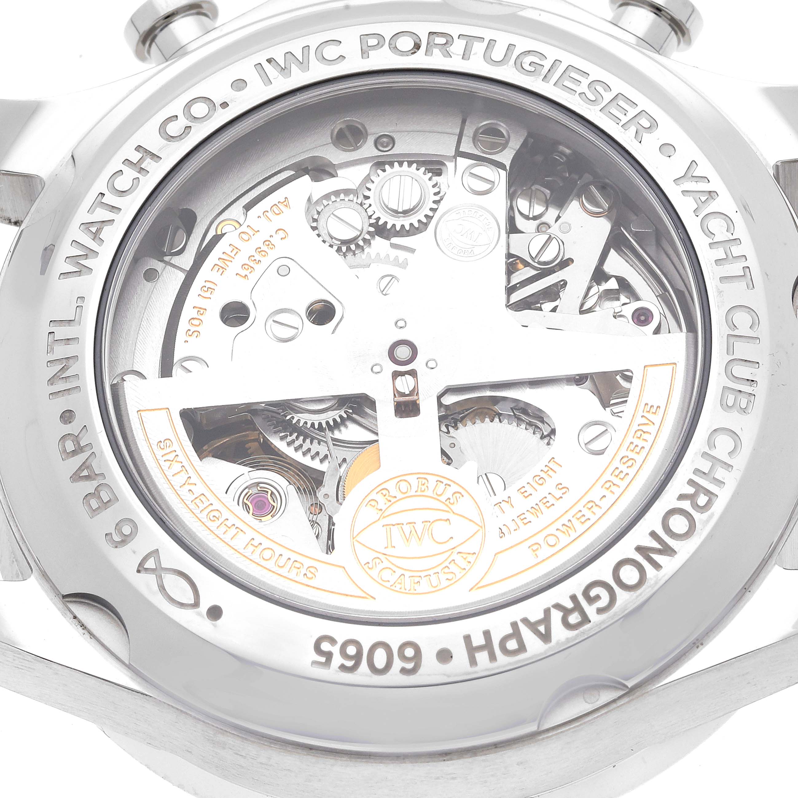 The image shows the back view of an IWC Portugieser Yacht Club Chronograph watch, revealing its mechanical movement.