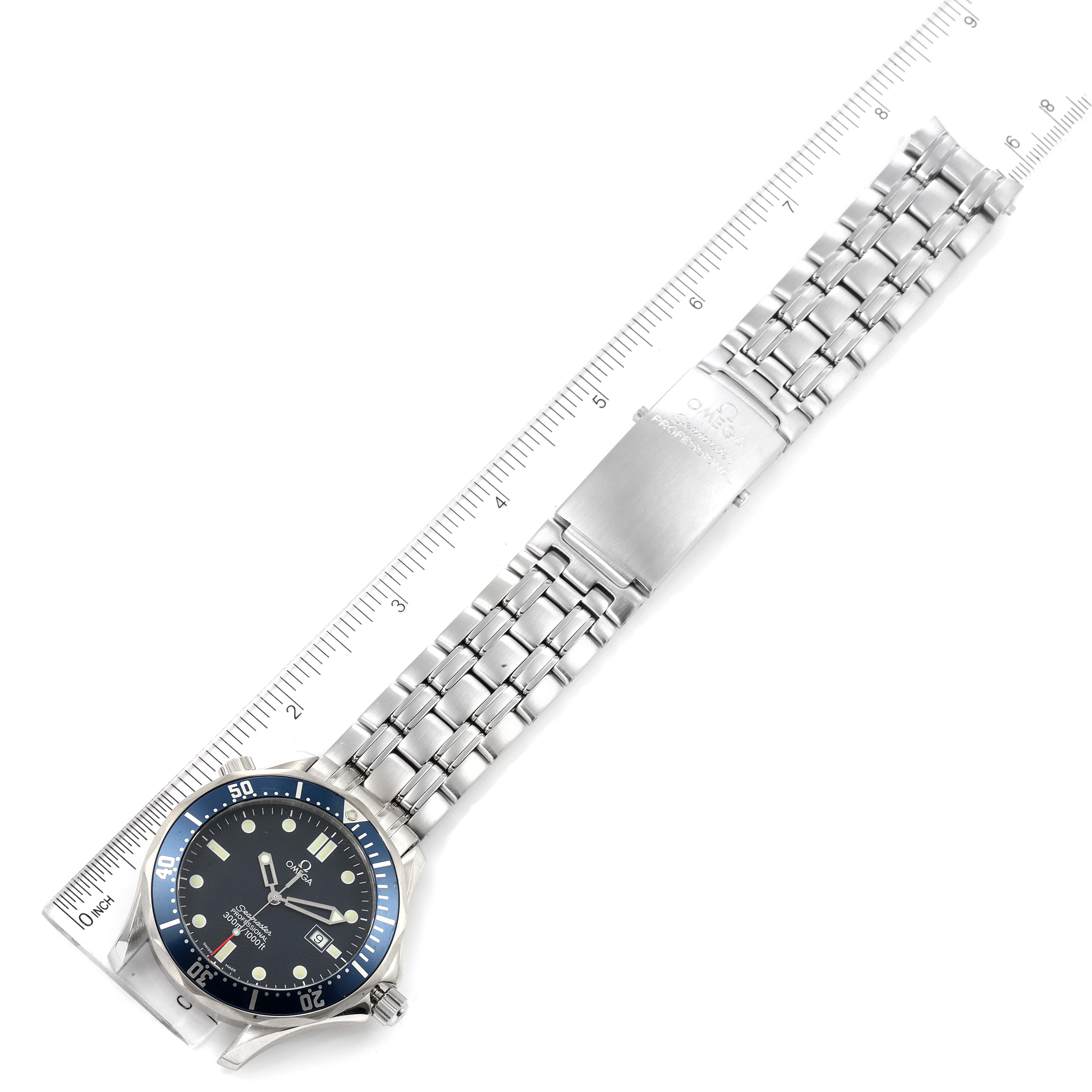 The Omega Seamaster 2541.80.00 Men's Stainless Steel Blue Dial 2541.80.00 Men's Stainless Steel Blue Dial watch is shown from above, displaying the full bracelet and the clasp, with a ruler for scale.