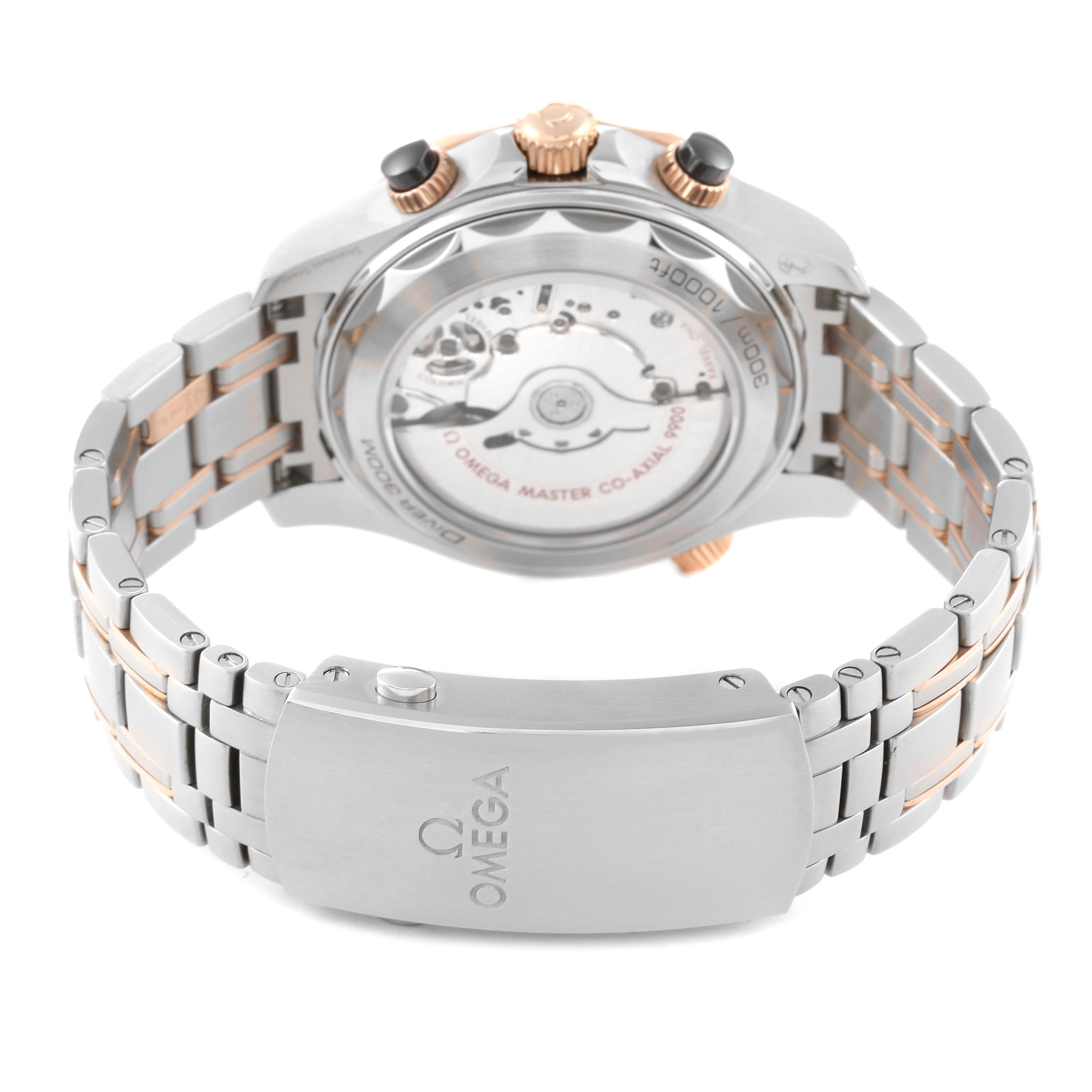 The image shows the back view of the Omega Seamaster 210.20.44.51.01.001 Men's Steel and Gold (two tone) Black Dial 210.20.44.51.01.001 Men's Steel and Gold (two tone) Black Dial watch, highlighting its open case back and part of the bracelet with the clasp.