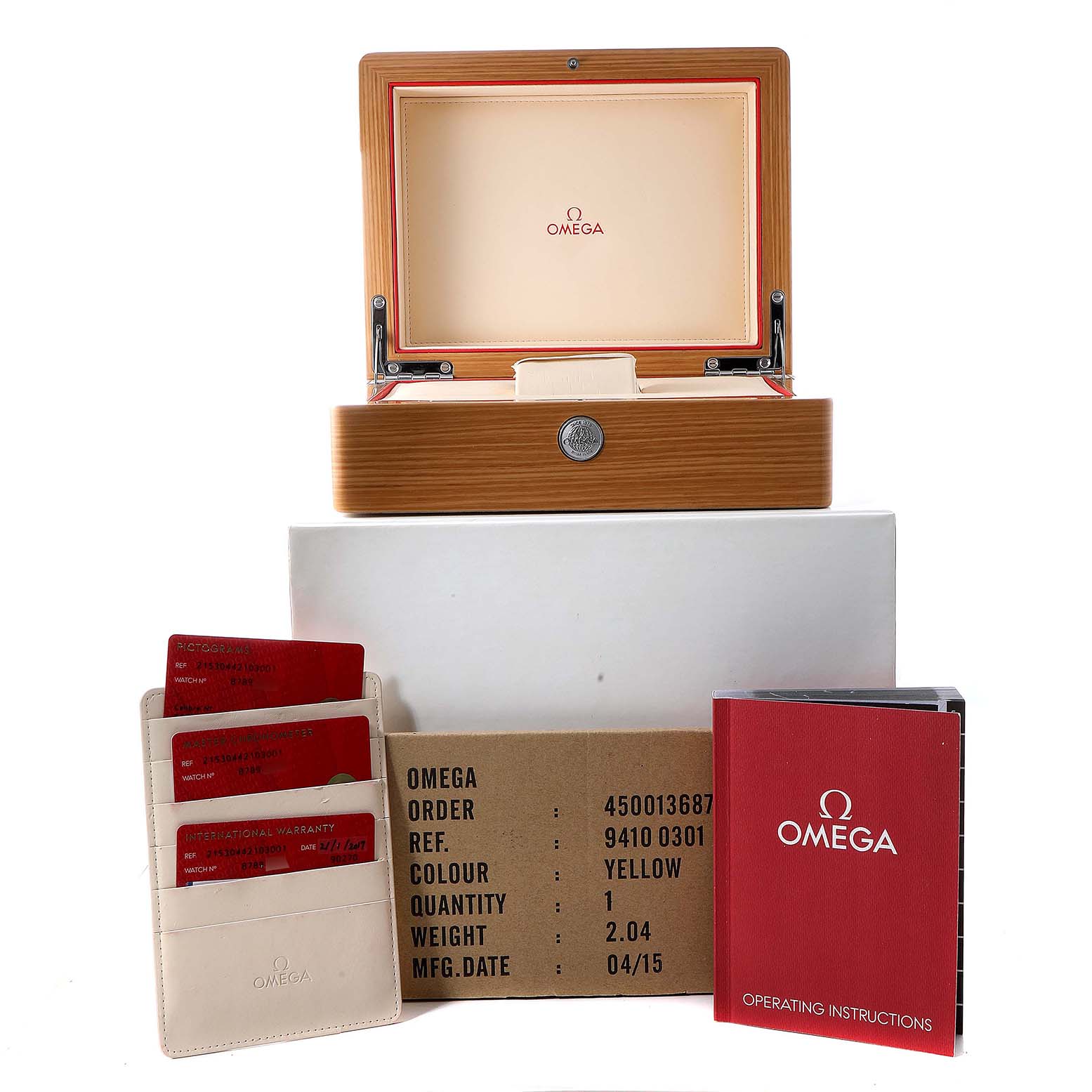 The image shows the Omega Planet Ocean 215.30.44.21.03.001 Men's Stainless Steel Blue Dial 215.30.44.21.03.001 Men's Stainless Steel Blue Dial model box, warranty cards, operating instructions, and outer packaging from a front angle.