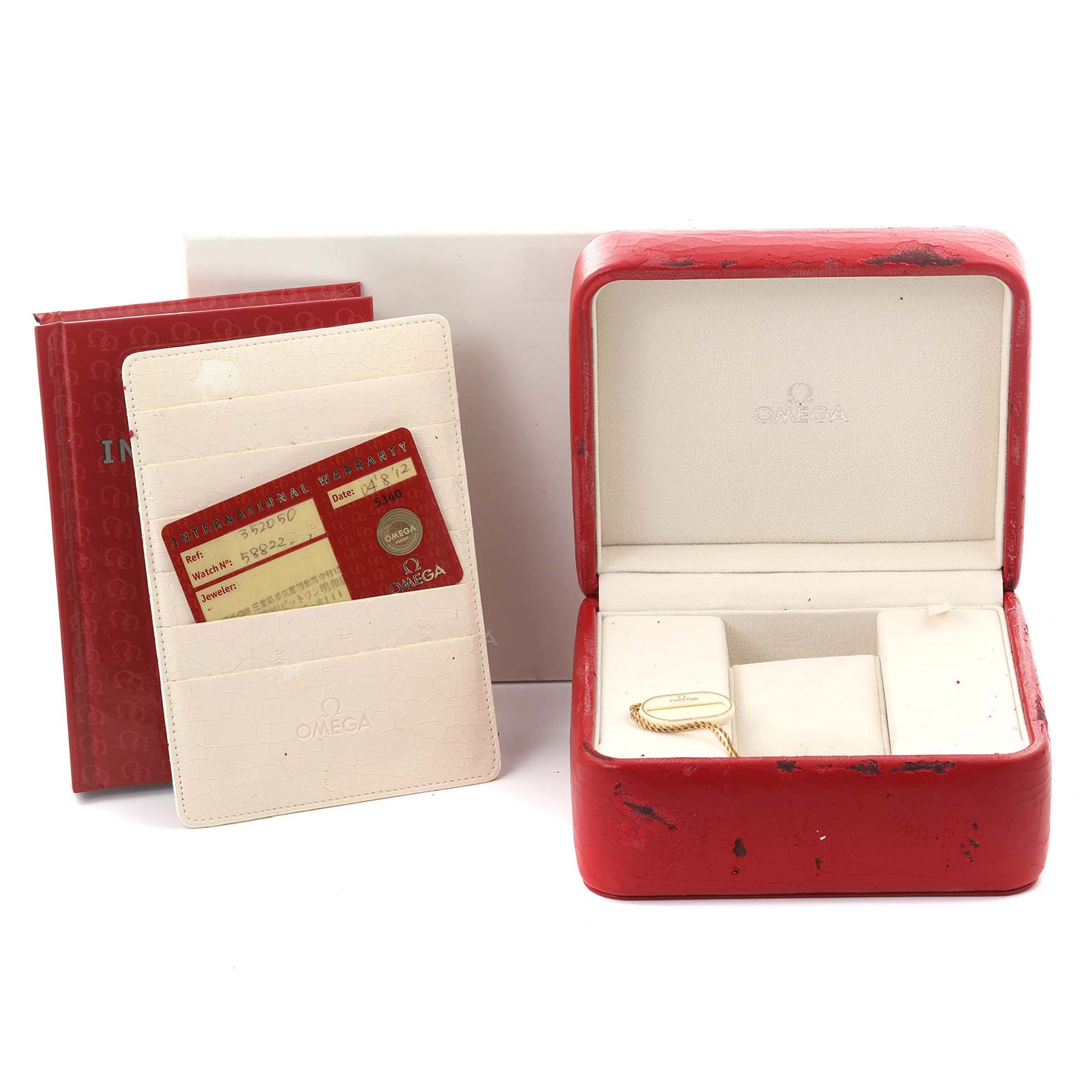 The image shows an Omega Speedmaster 3520.50.00 Men
s Stainless Steel Black Dial 3520.50.00 Men
s Stainless Steel Black Dial box, booklet, warranty card, and tag, viewed from the front.