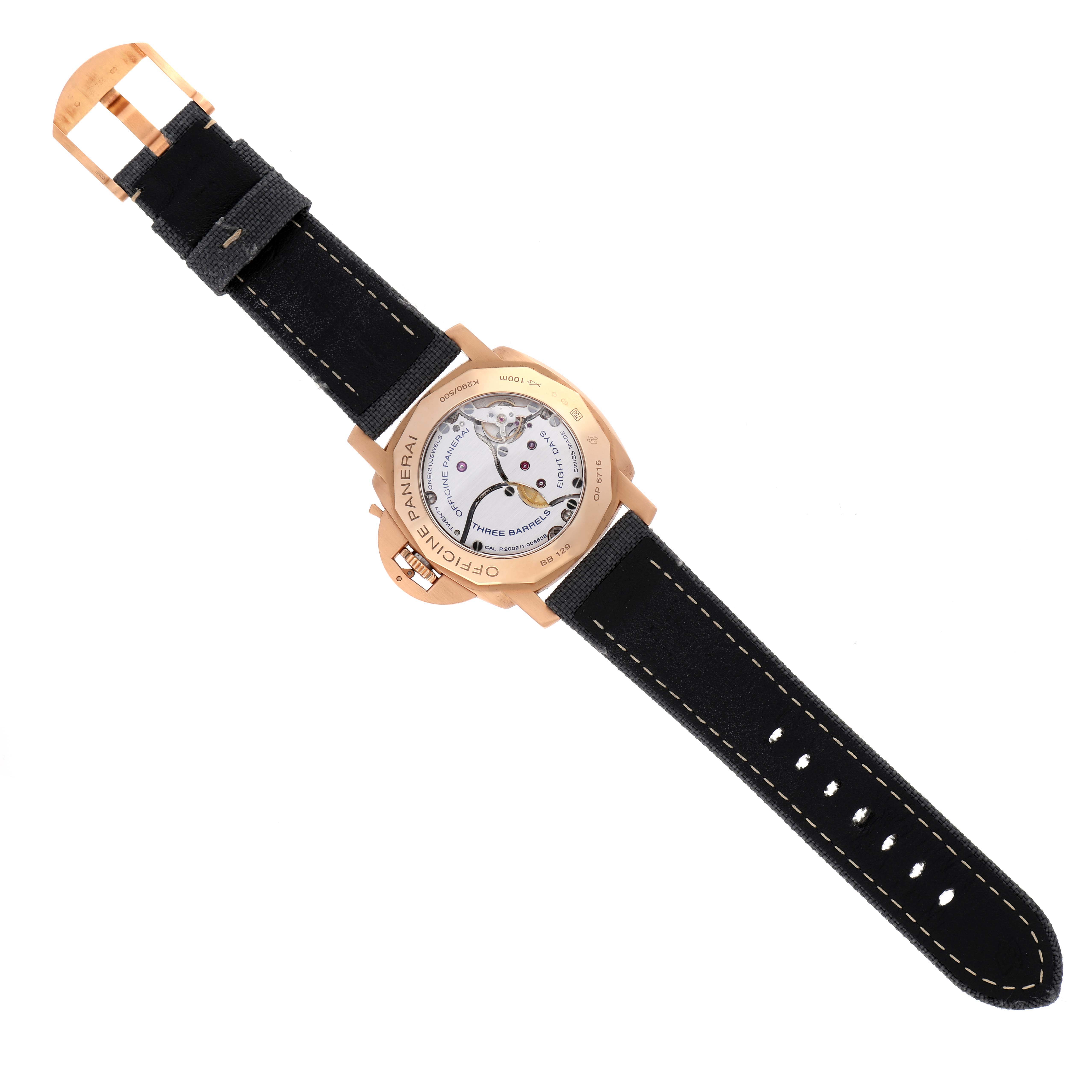 The image shows the back view of a Panerai Luminor PAM00289 Men's Rose Gold Brown Dial PAM00289 Men's Rose Gold Brown Dial watch with its movement and a black strap visible.