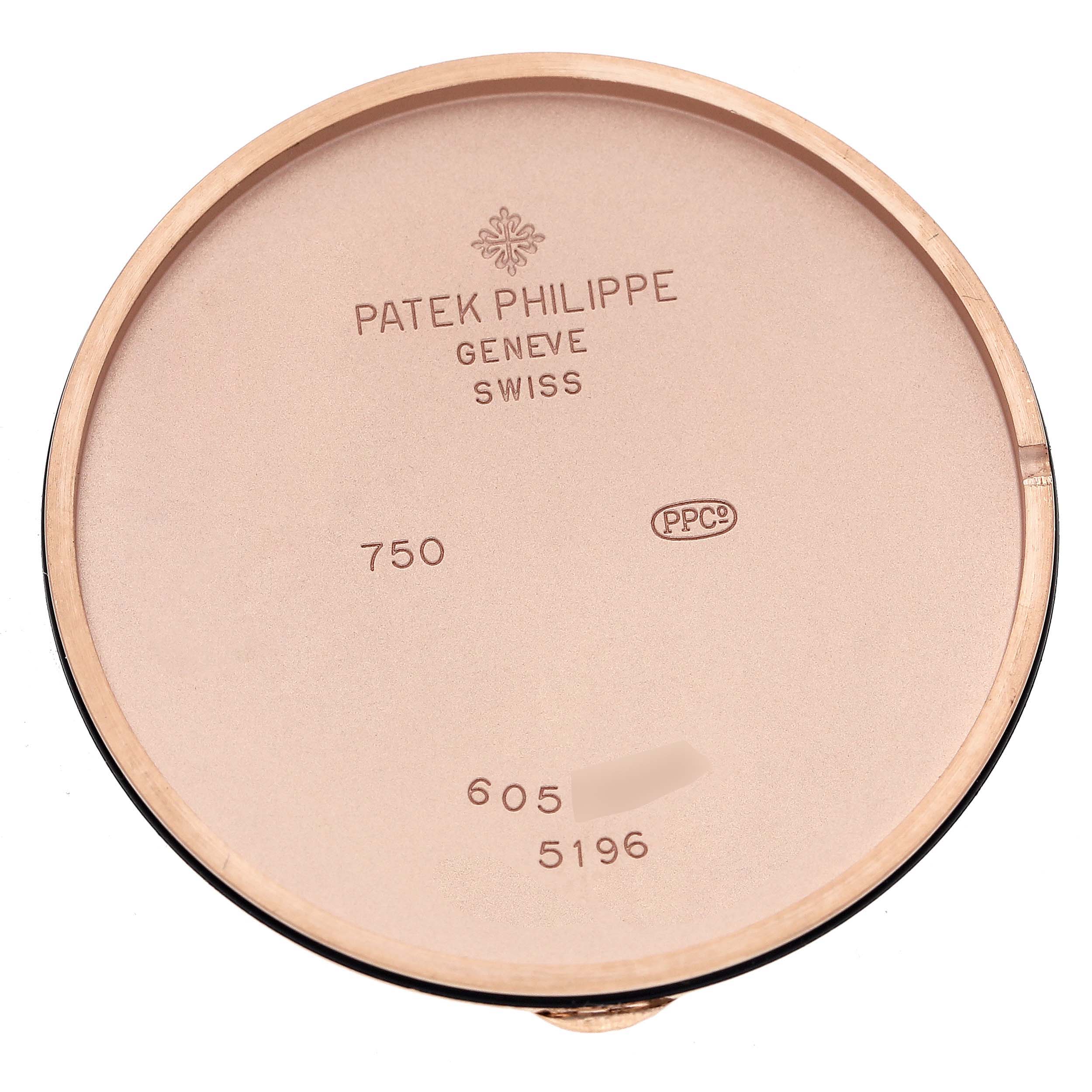 This image shows the interior case back of a Patek Philippe Calatrava 5196R-001 Men's Rose Gold Silver Dial 5196R-001 Men's Rose Gold Silver Dial model watch, emphasizing its engravings and hallmarks.