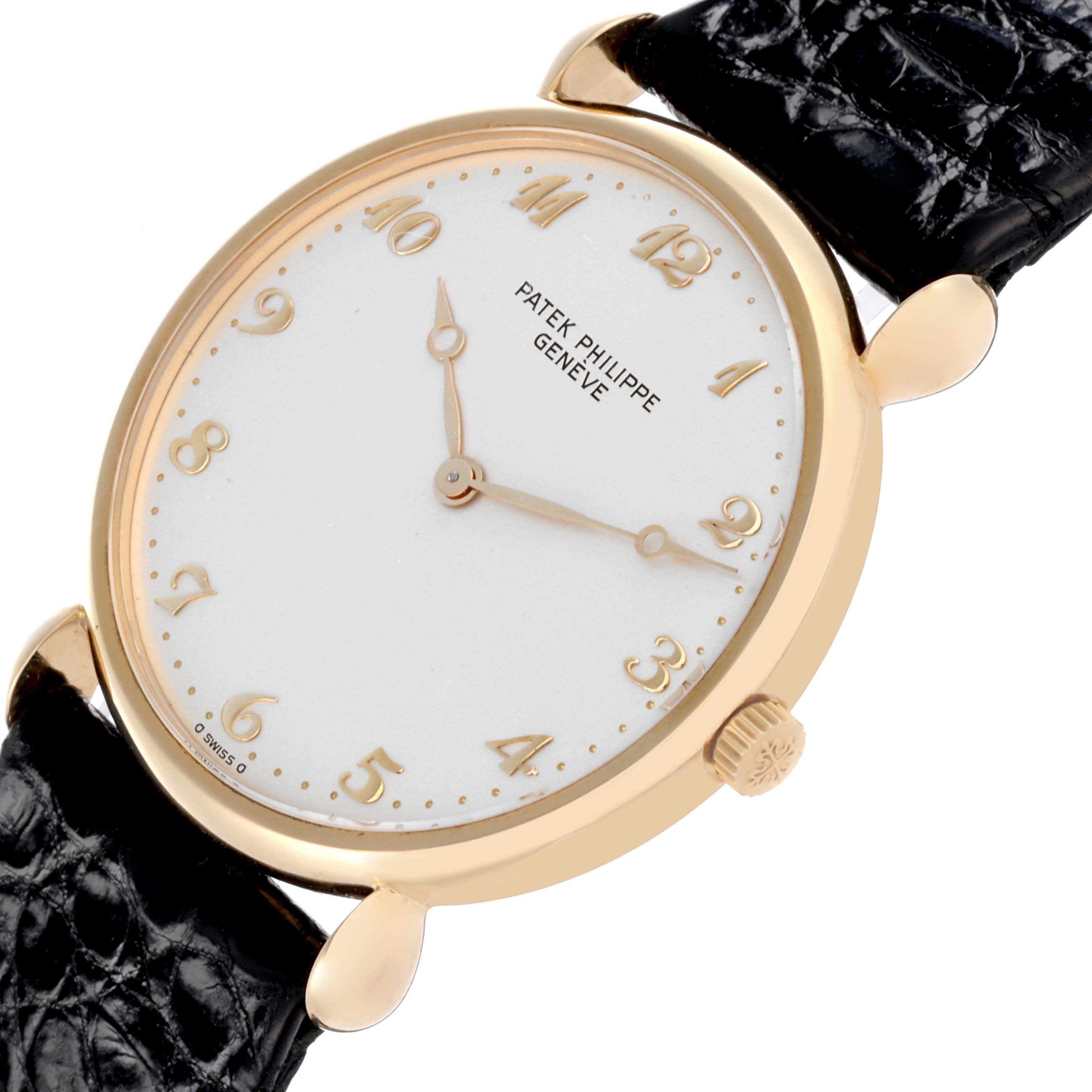 The Patek Philippe Calatrava Men's Yellow Gold Silver Dial Men's Yellow Gold Silver Dial watch is shown at an oblique angle, displaying its face, crown, and leather strap.