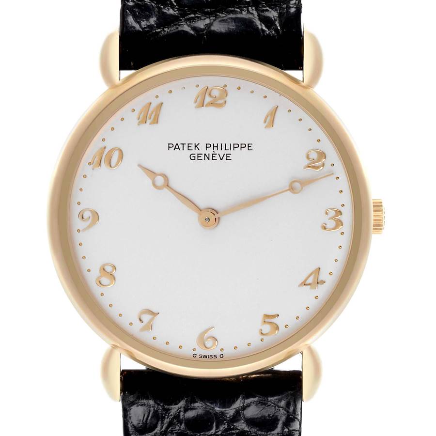 The image shows a front view of the Patek Philippe Calatrava watch, highlighting the dial, hands, and leather strap.