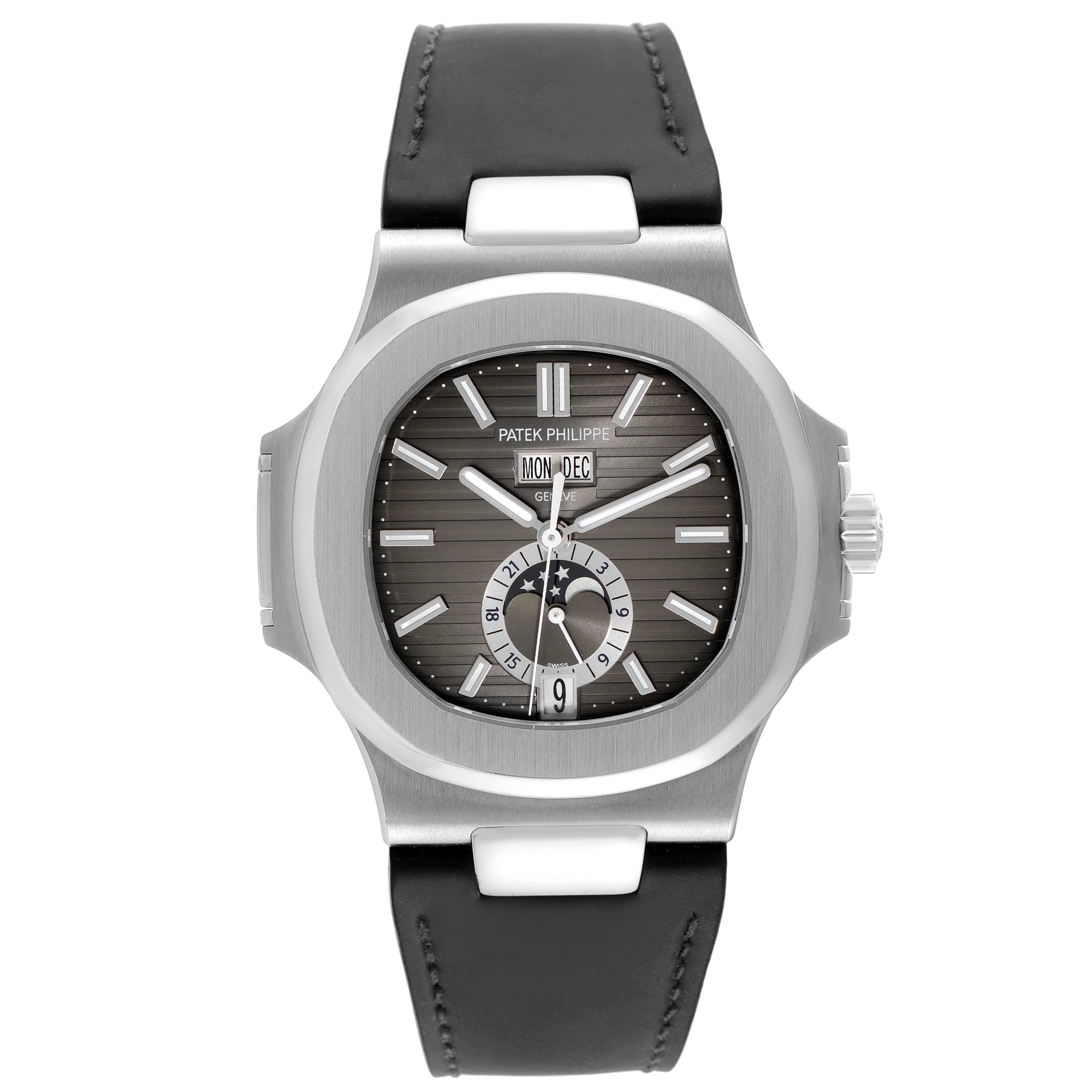 The image shows a front view of a Patek Philippe Nautilus 5726A-001 Men's Stainless Steel Black Dial 5726A-001 Men's Stainless Steel Black Dial watch, displaying the dial, hands, and leather strap.