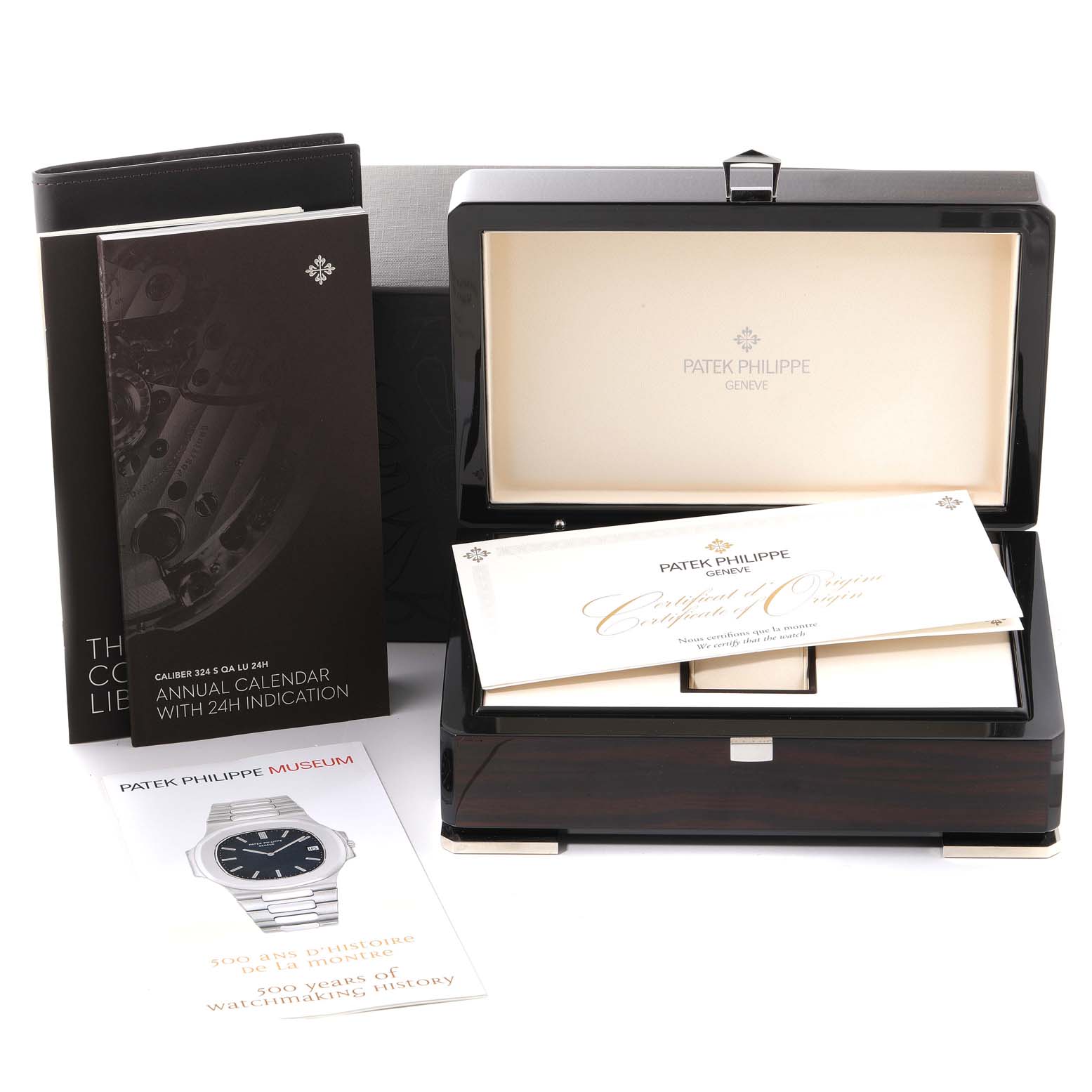 The image shows a Patek Philippe Nautilus 5726A-001 Men's Stainless Steel Black Dial 5726A-001 Men's Stainless Steel Black Dial watch box, open with certificates and manuals displayed around it.