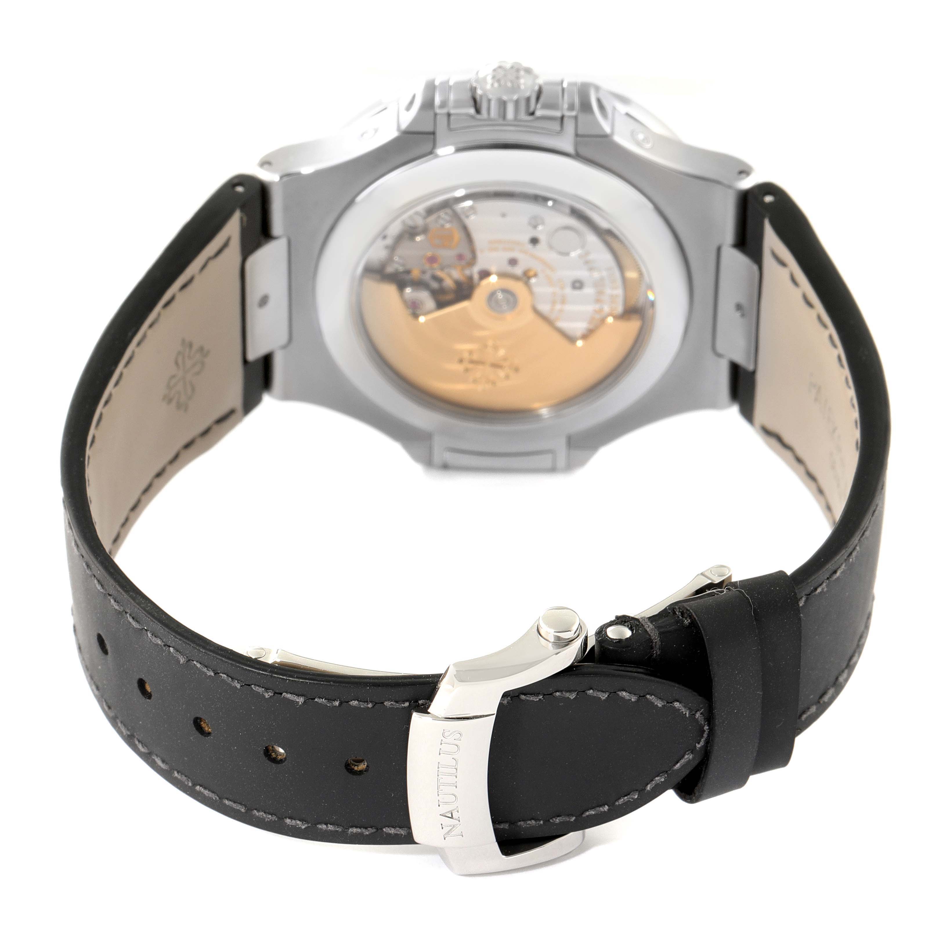 The image shows the back view of the Patek Philippe Nautilus 5726A-001 Men's Stainless Steel Black Dial 5726A-001 Men's Stainless Steel Black Dial watch, highlighting its movement and leather strap with buckle.