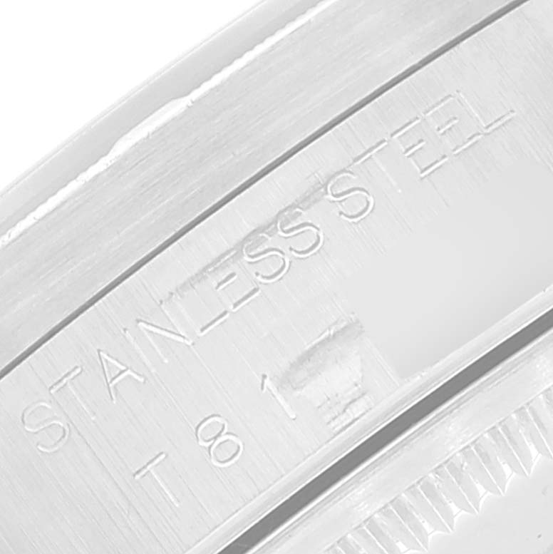 This is a close-up view of the stainless steel, with the engraved "STAINLESS STEEL" text on the Rolex Air-King 14010 Men's Stainless Steel Pink Dial 14010 Men's Stainless Steel Pink Dial watch.