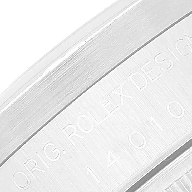 The image shows a close-up of the edge and engraved markings on the caseback of a Rolex Air-King 14010 Men's Stainless Steel Pink Dial 14010 Men's Stainless Steel Pink Dial watch.