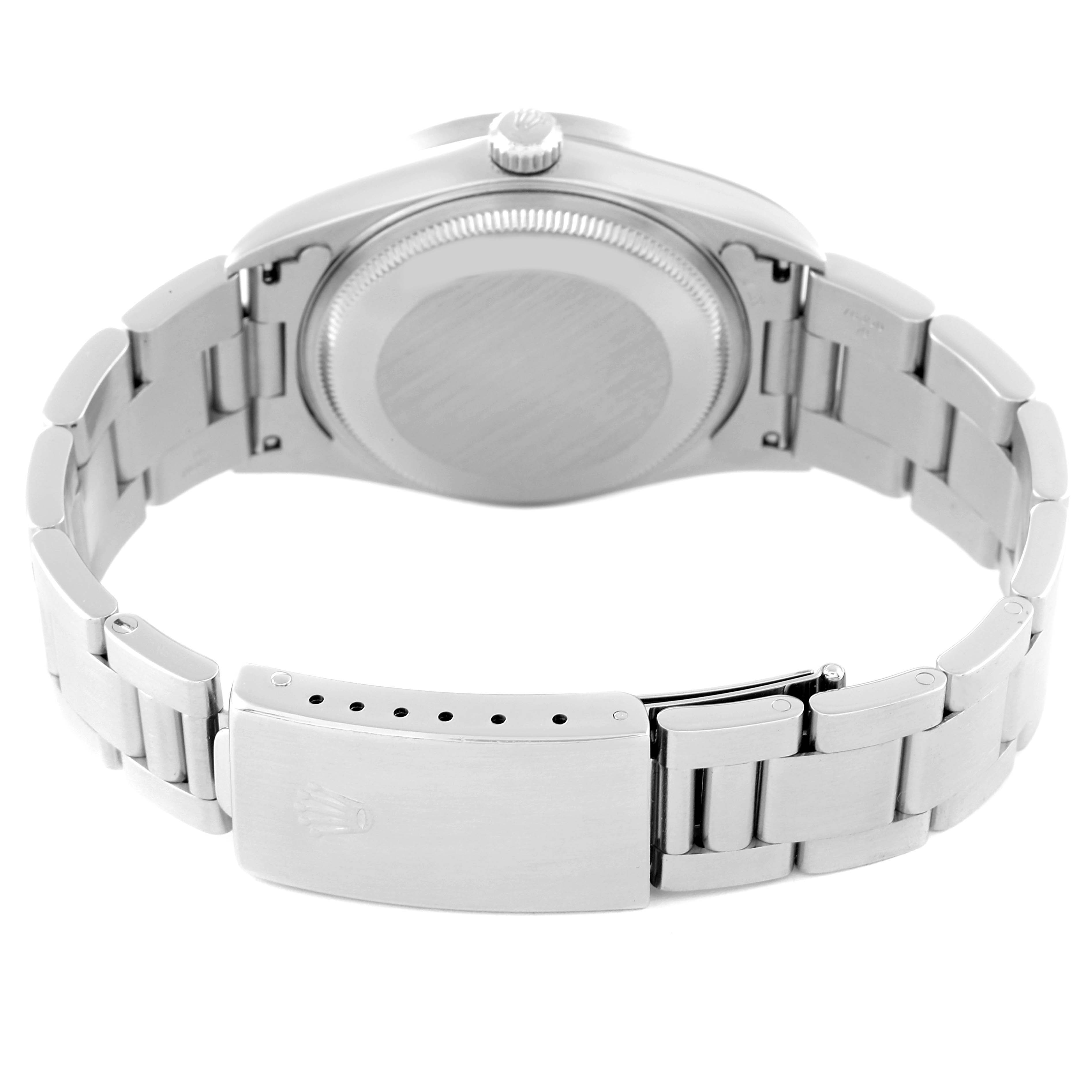 This image shows the back view of the Rolex Air-King 14010 Men's Stainless Steel Pink Dial 14010 Men's Stainless Steel Pink Dial watch, highlighting its clasp, bracelet, and case back.