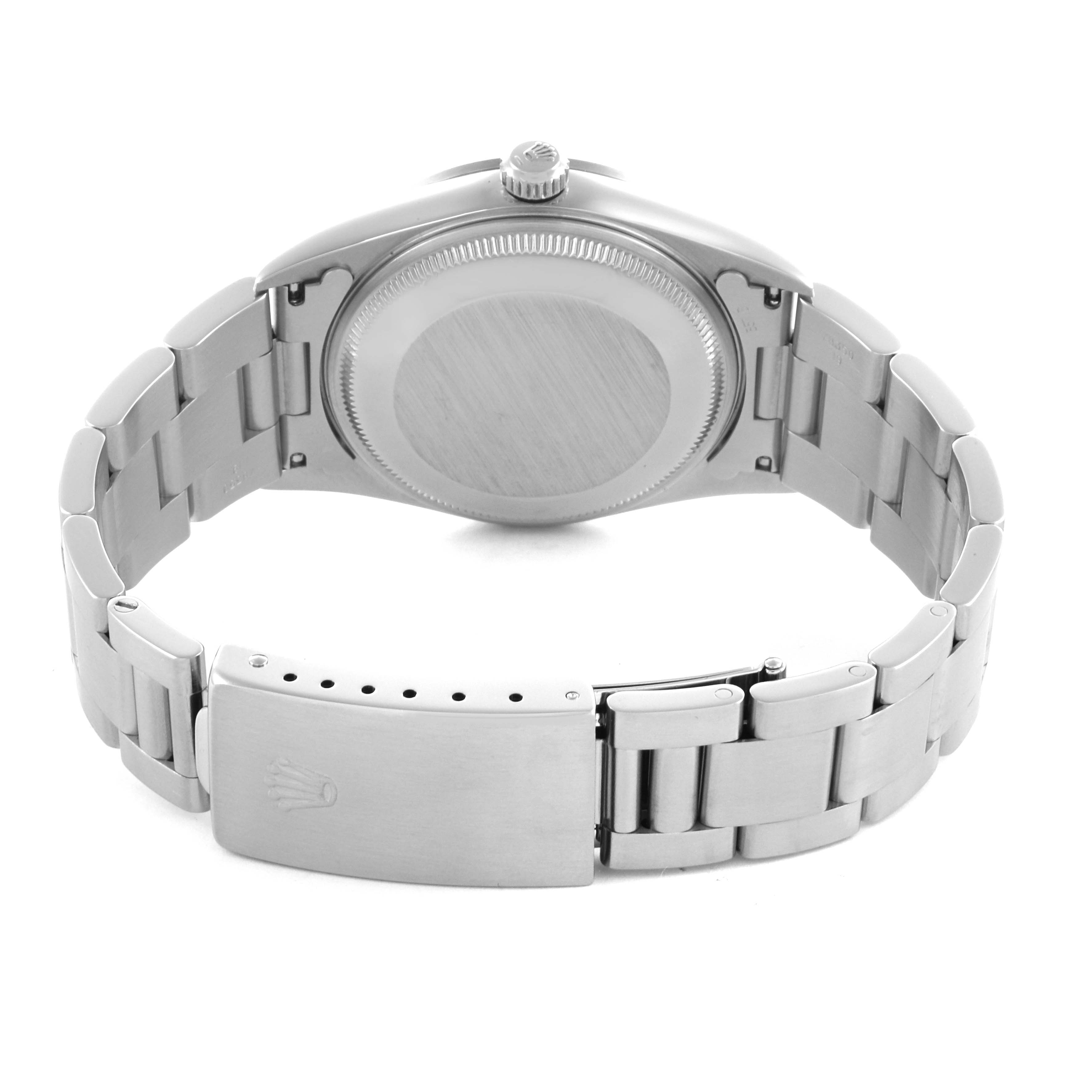 The Rolex Air-King 14000 Men's Stainless Steel Pink Dial 14000 Men's Stainless Steel Pink Dial watch is shown from the back, highlighting the case back and bracelet clasp.