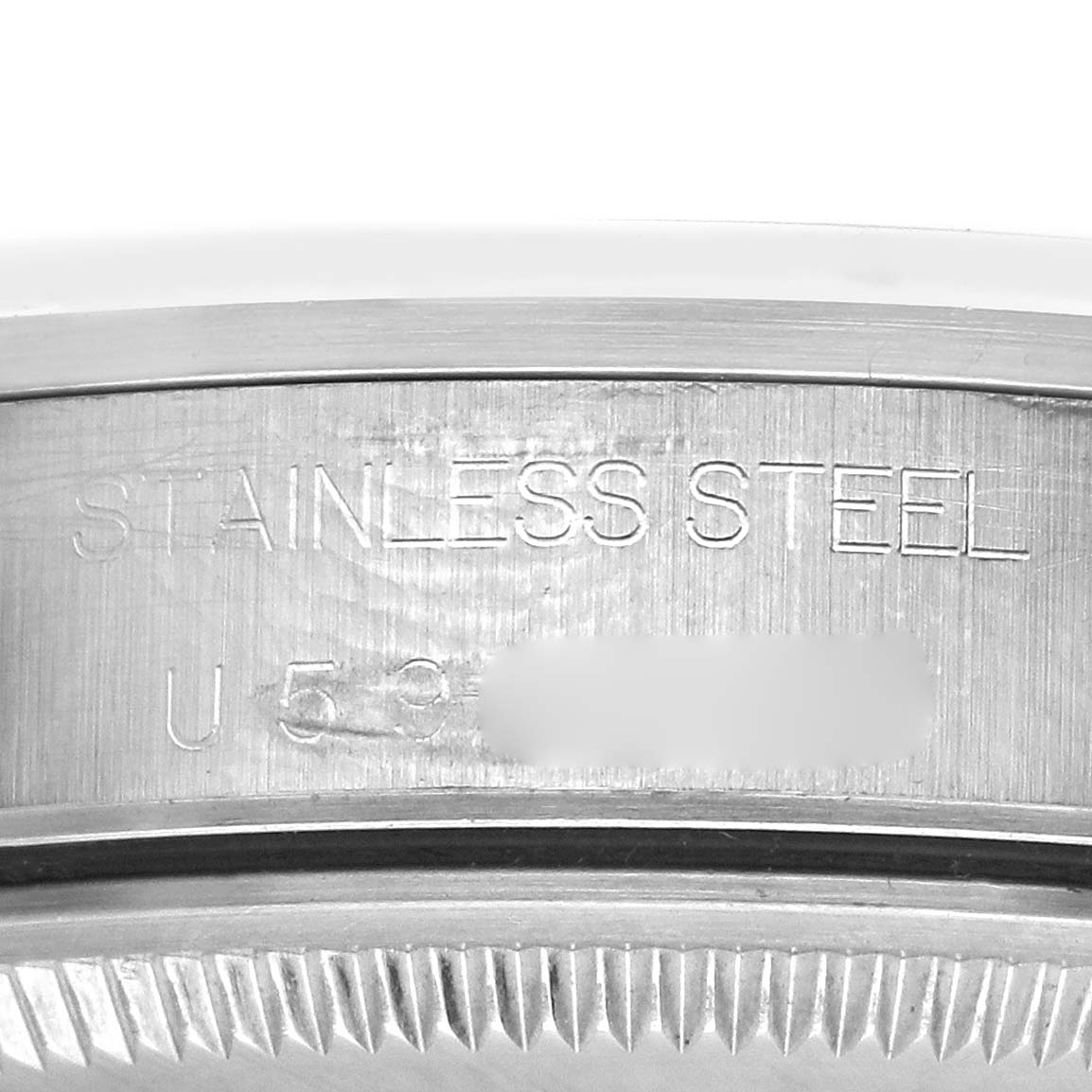 The image shows the side view of the Rolex Air-King 14000 Men's Stainless Steel Pink Dial 14000 Men's Stainless Steel Pink Dial watch, highlighting its engraved stainless steel case and ridged edge.