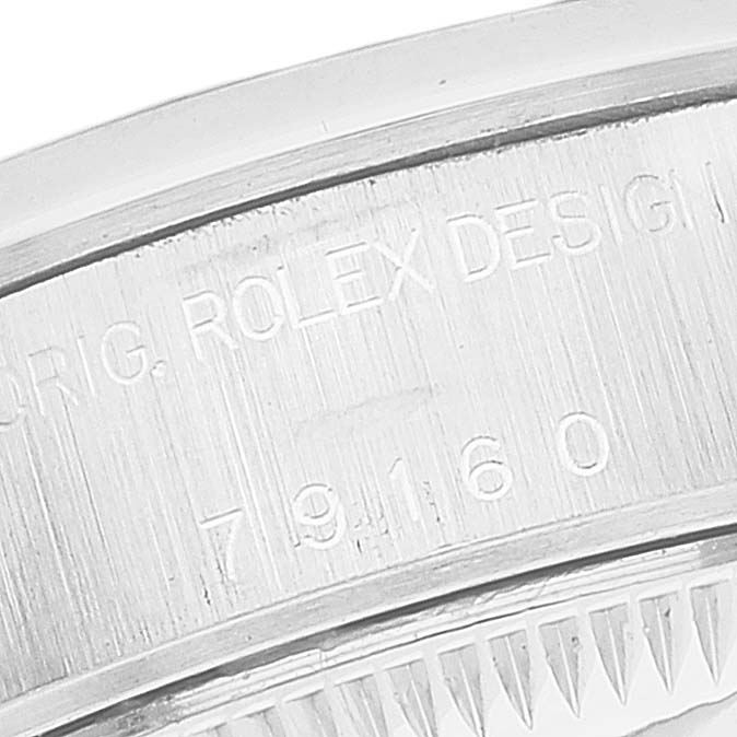 This close-up angle shows the engraved case back of the Rolex Date 79160 Women's Stainless Steel White Dial 79160 Women's Stainless Steel White Dial model watch.