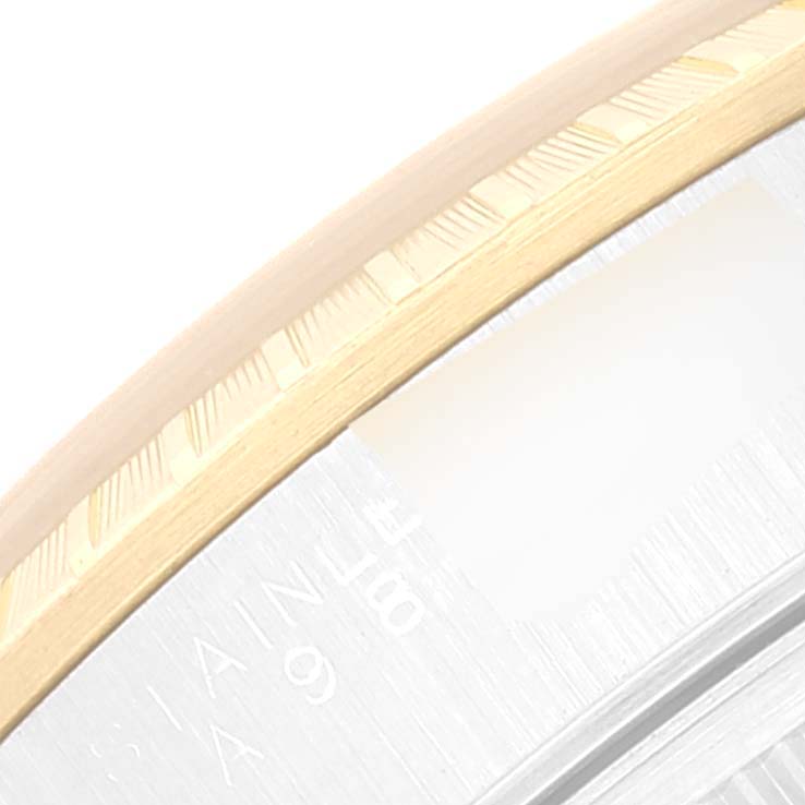 This close-up image shows the fluted bezel detail of a Rolex Date 15223 Men
s Steel and Gold (two tone) Champagne Dial 15223 Men
s Steel and Gold (two tone) Champagne Dial watch.