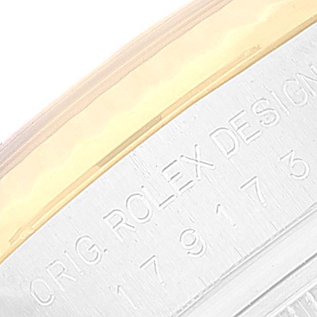 This image shows a close-up of the case side of a Rolex Datejust 179173 Women's Steel and Gold (two tone) Silver Dial 179173 Women's Steel and Gold (two tone) Silver Dial, highlighting the engraved model information.
