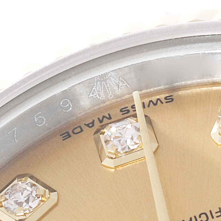 This close-up image shows the 7-9 digit markers, diamond accents, and "SWISS MADE" text on the dial of a Rolex Datejust 179173 Women's Steel and Gold (two tone) Champagne Dial 179173 Women's Steel and Gold (two tone) Champagne Dial model.