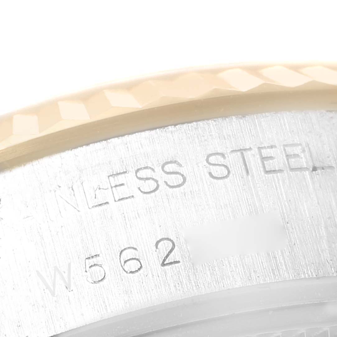 The image shows a close-up of the stainless steel case and part of the fluted bezel of a Rolex Datejust 69173 Women's Steel and Gold (two tone) Champagne Dial 69173 Women's Steel and Gold (two tone) Champagne Dial watch.