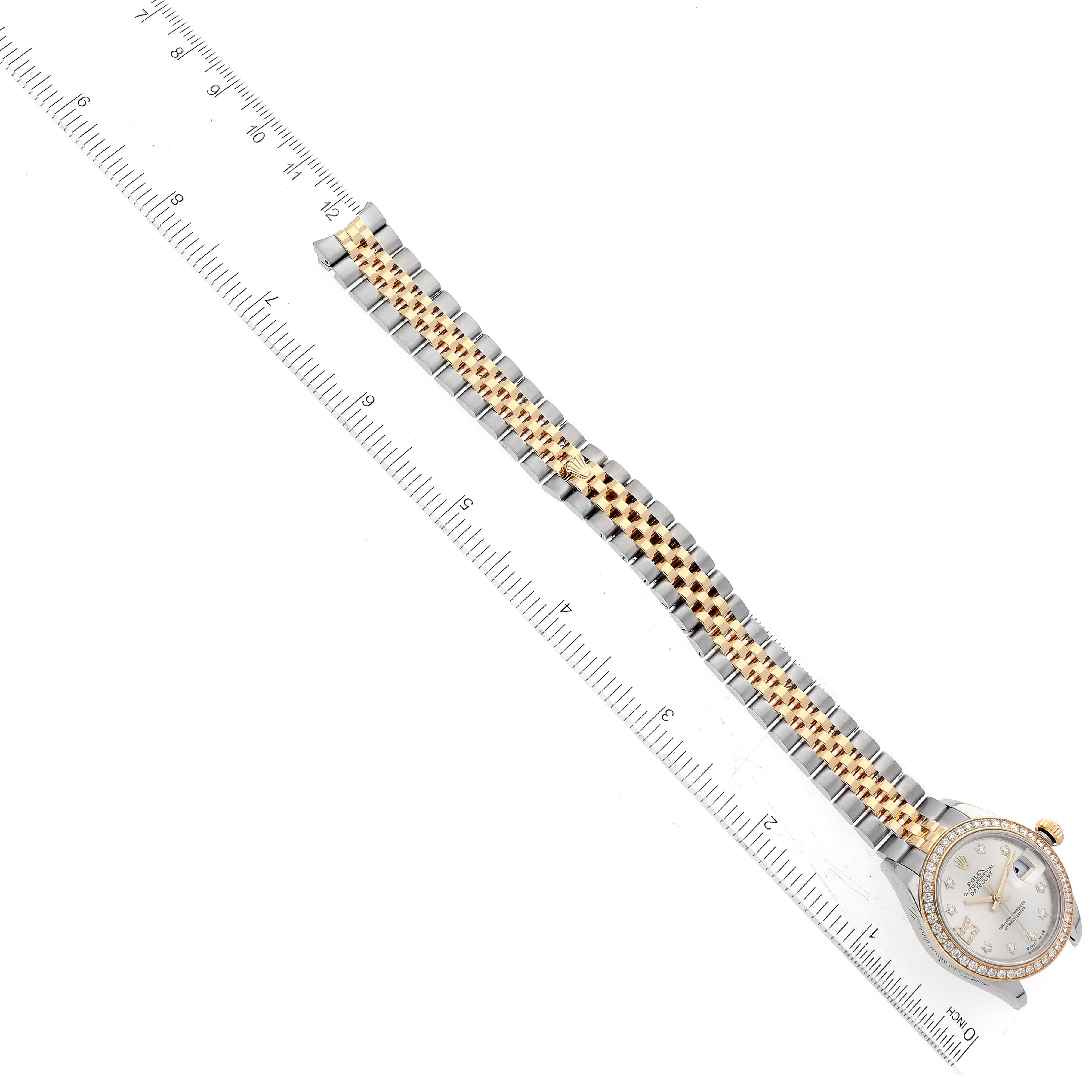This image depicts a Rolex Datejust 279383 Women's Steel and Gold (two tone) Silver Dial 279383 Women's Steel and Gold (two tone) Silver Dial watch, showcasing a frontal view of the face and the full length of the bracelet band along a ruler.